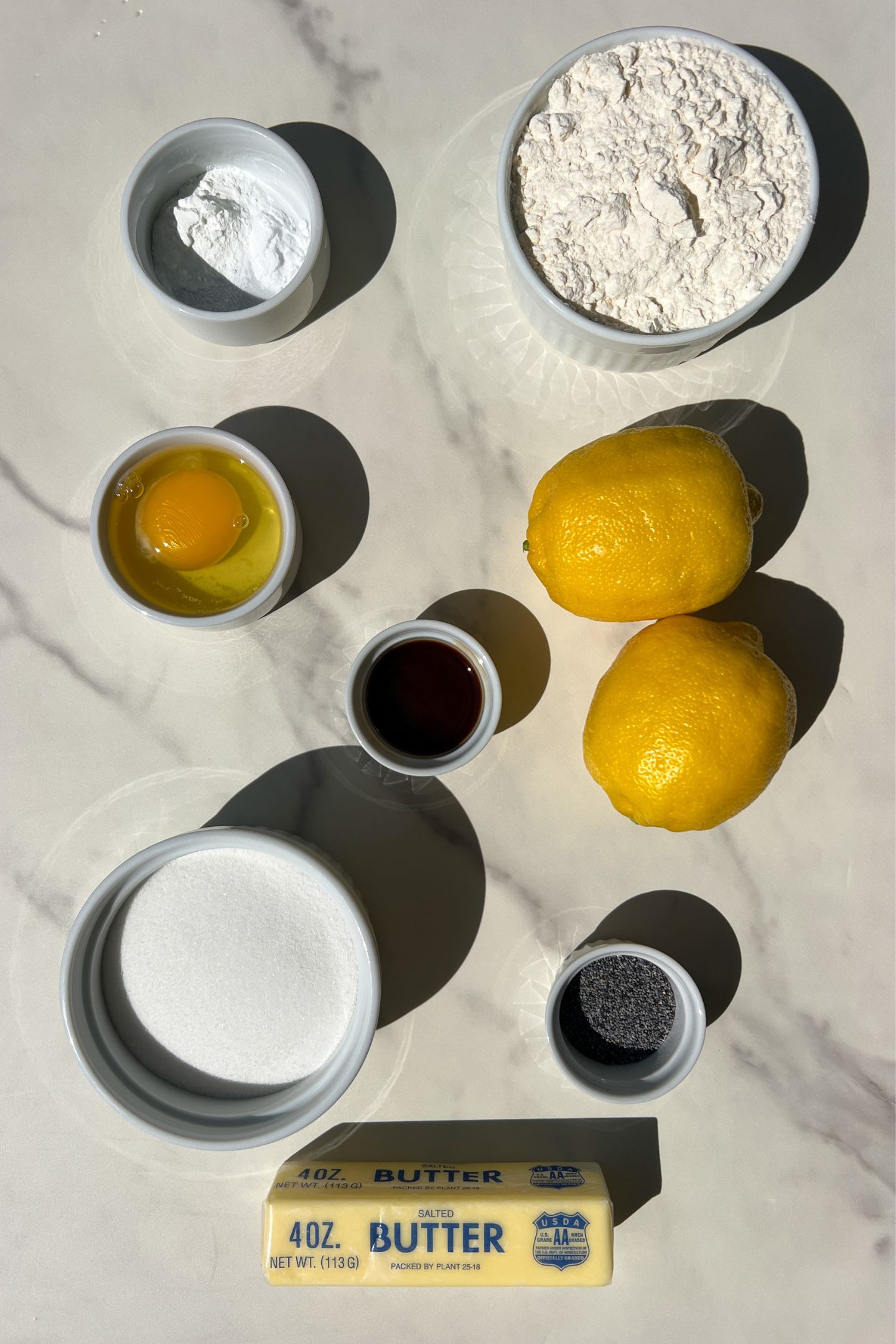 Ingredients measured out in bowls to make poppy seed cookies.