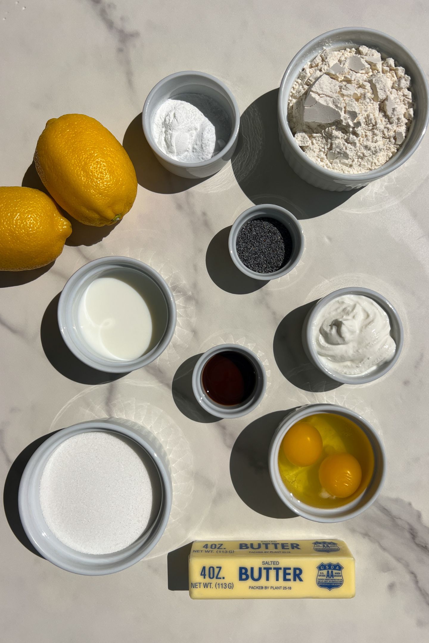 Ingredients to make lemon and poppy seed cupcakes.