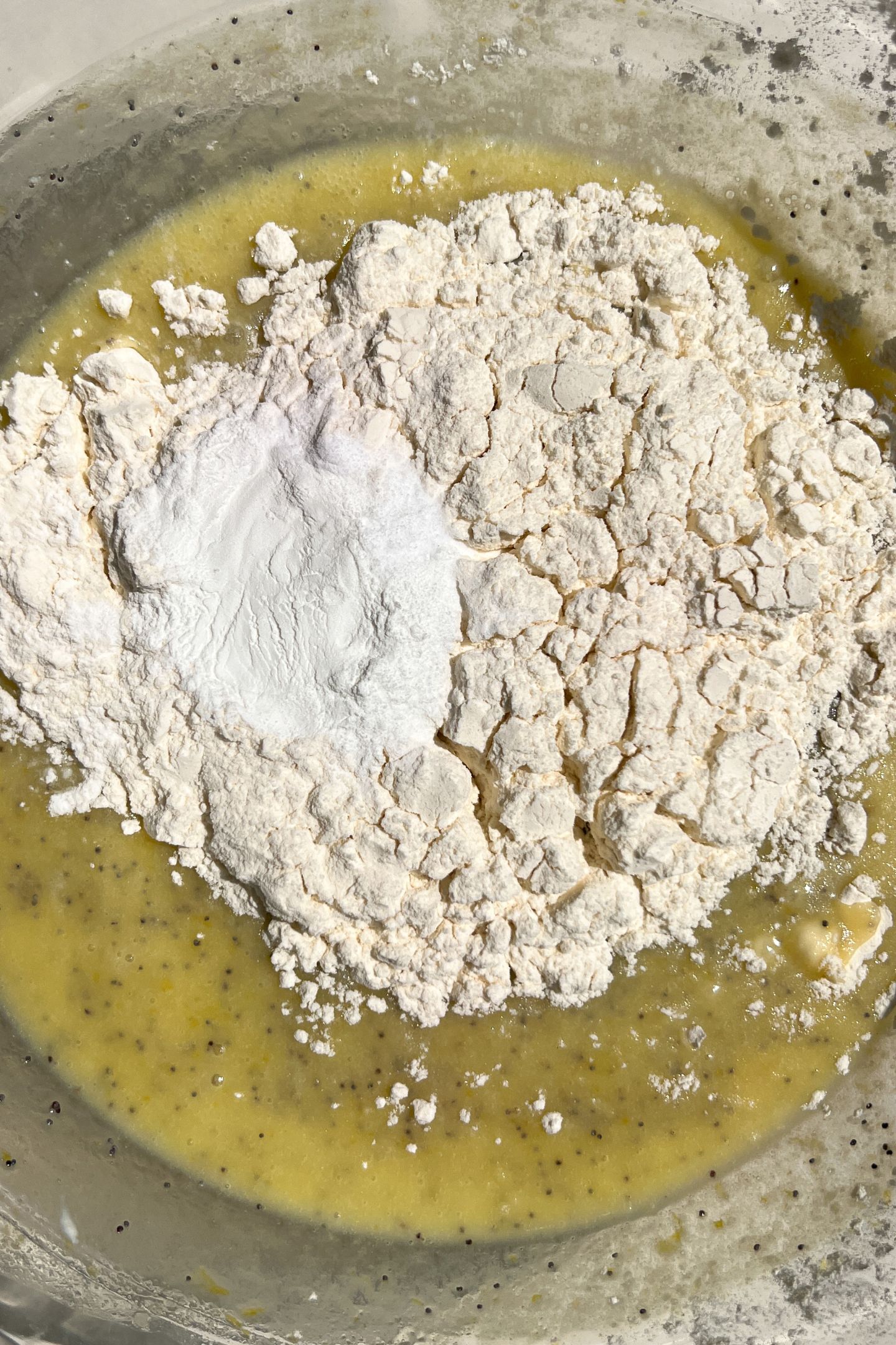 Wet and dry ingredients for the cupcake batter in a bowl.