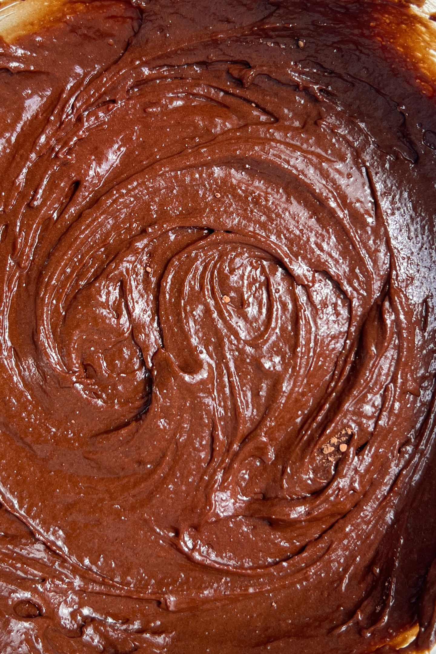 Wet and dry ingredients mixed together in a bowl.