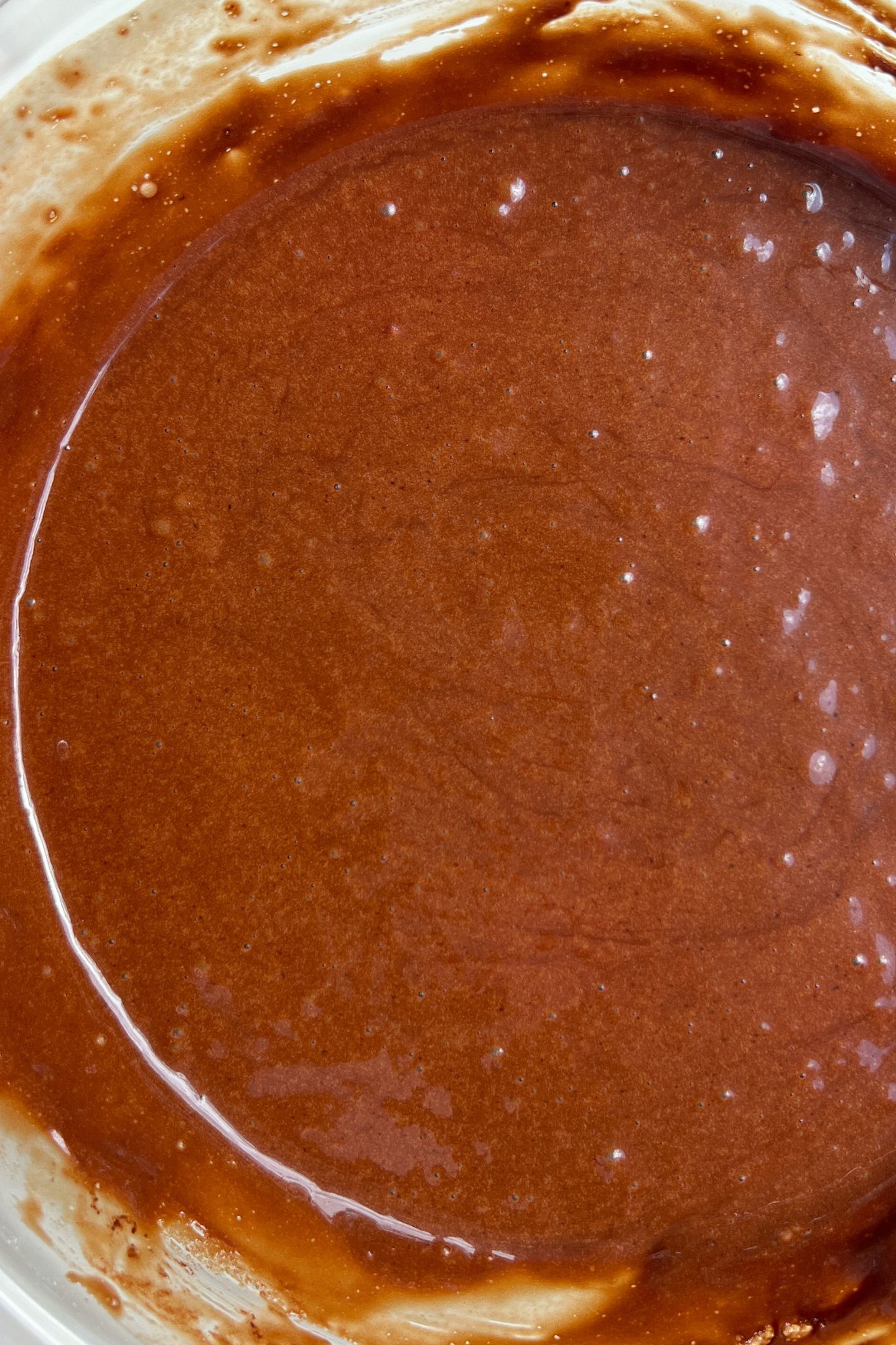 Chocolate cake batter in a bowl.