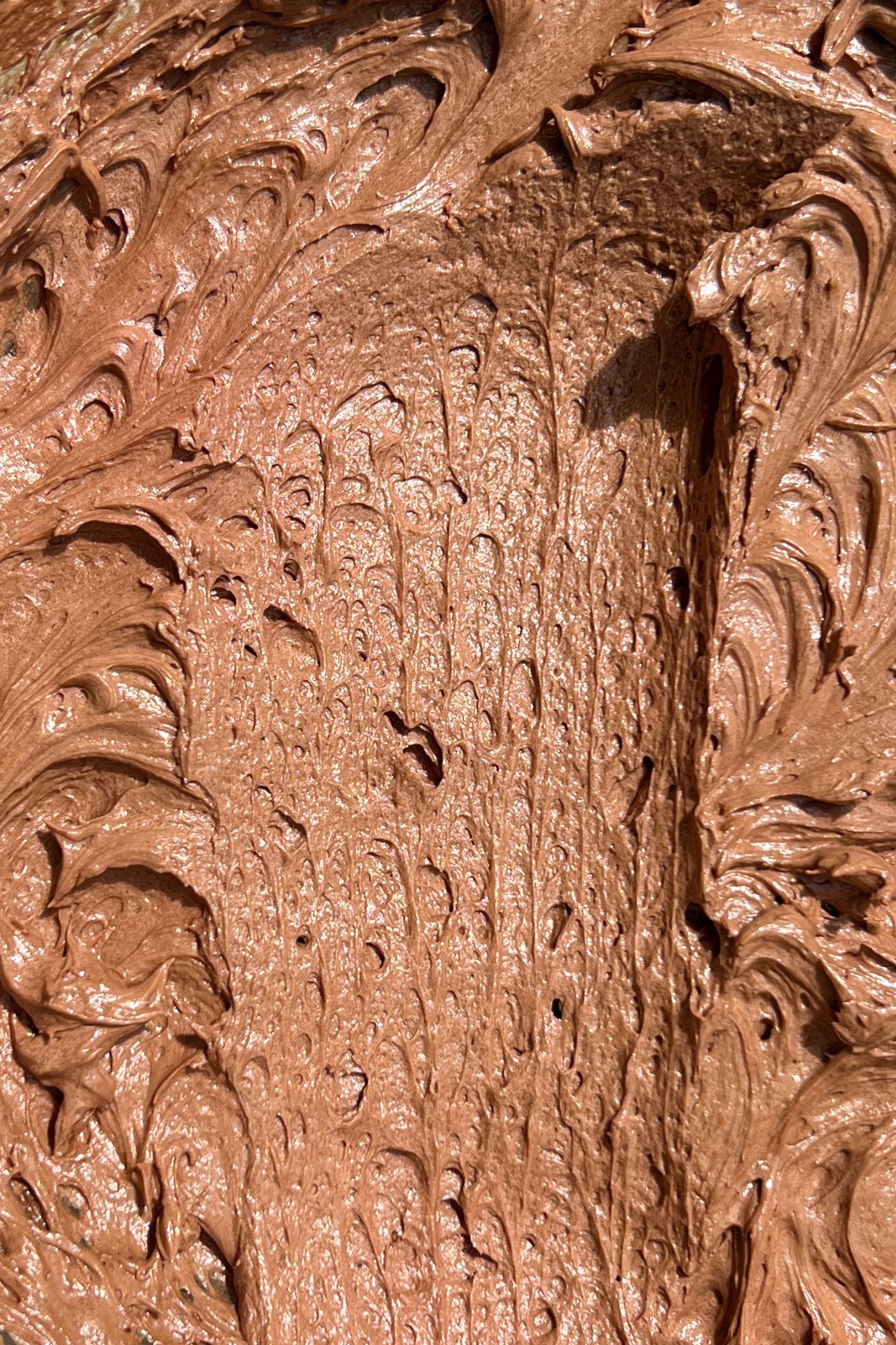 Chocolate cream cheese frosting in a bowl.