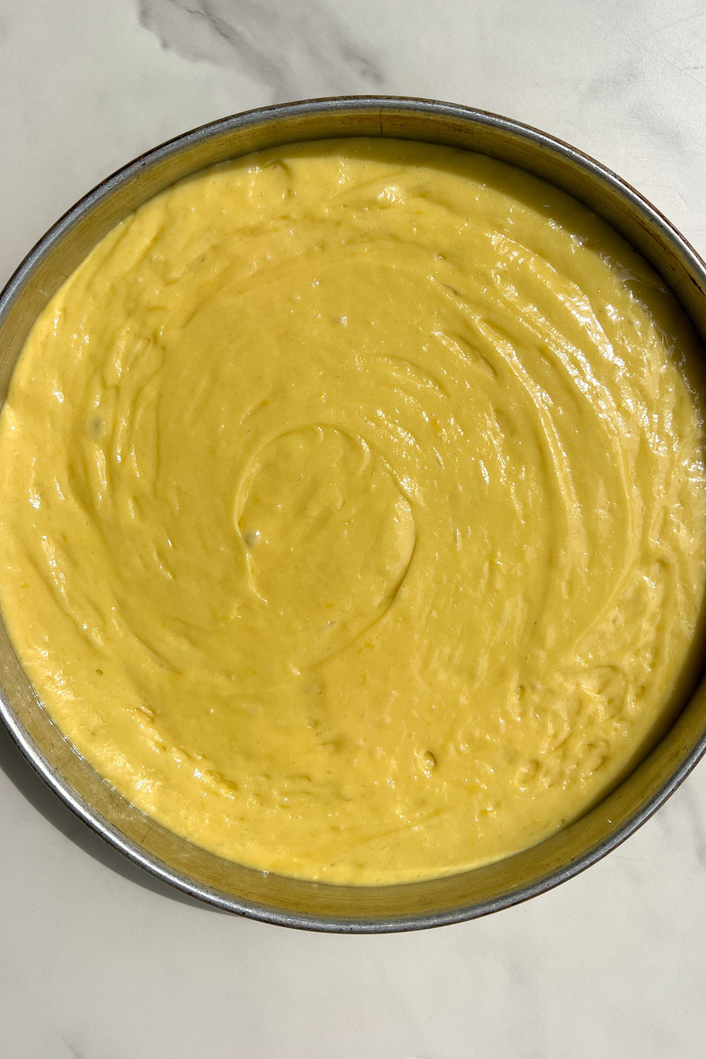 Lemon cake batter in pan.