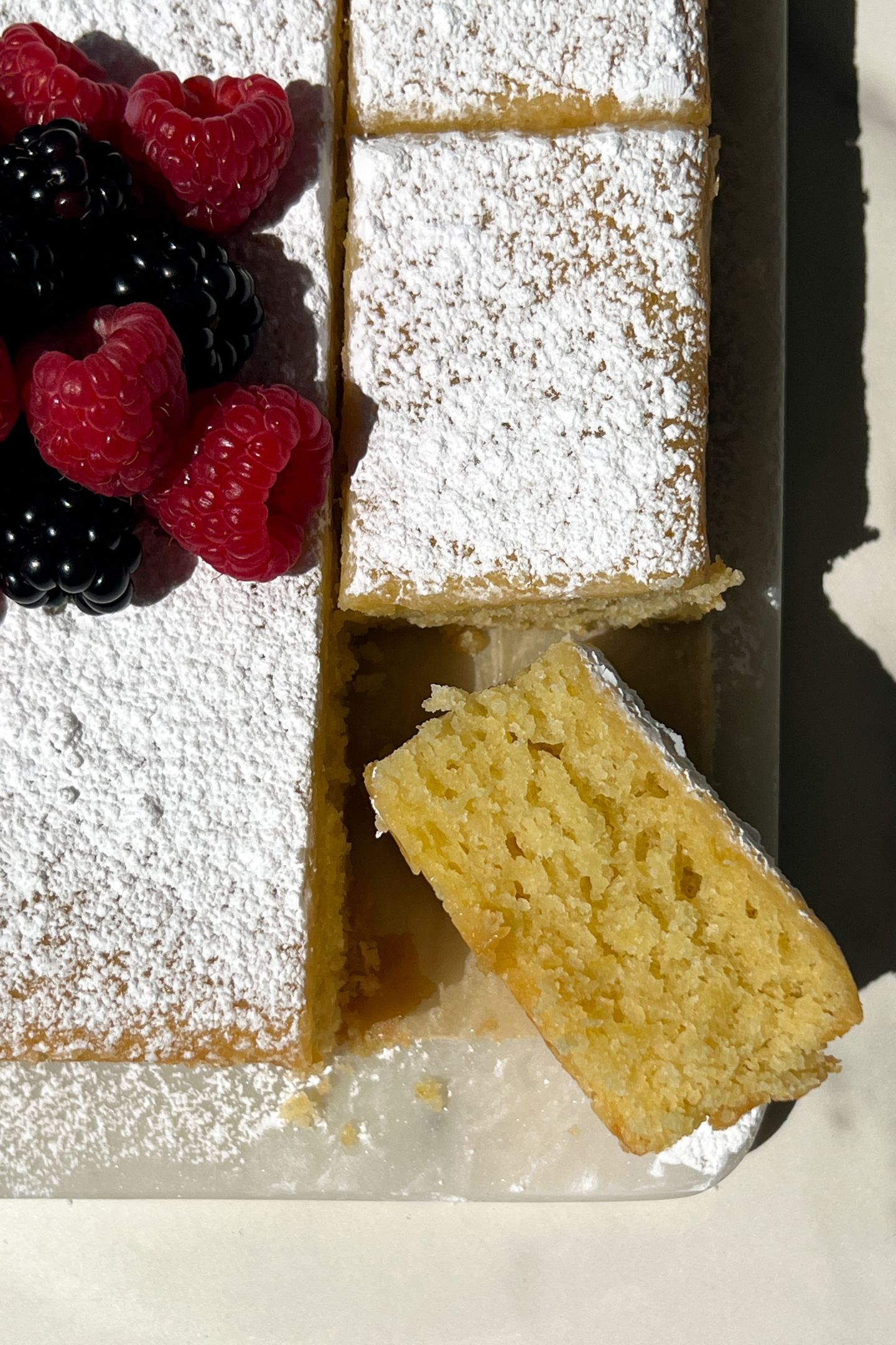 A slice of olive oil cake on its side.