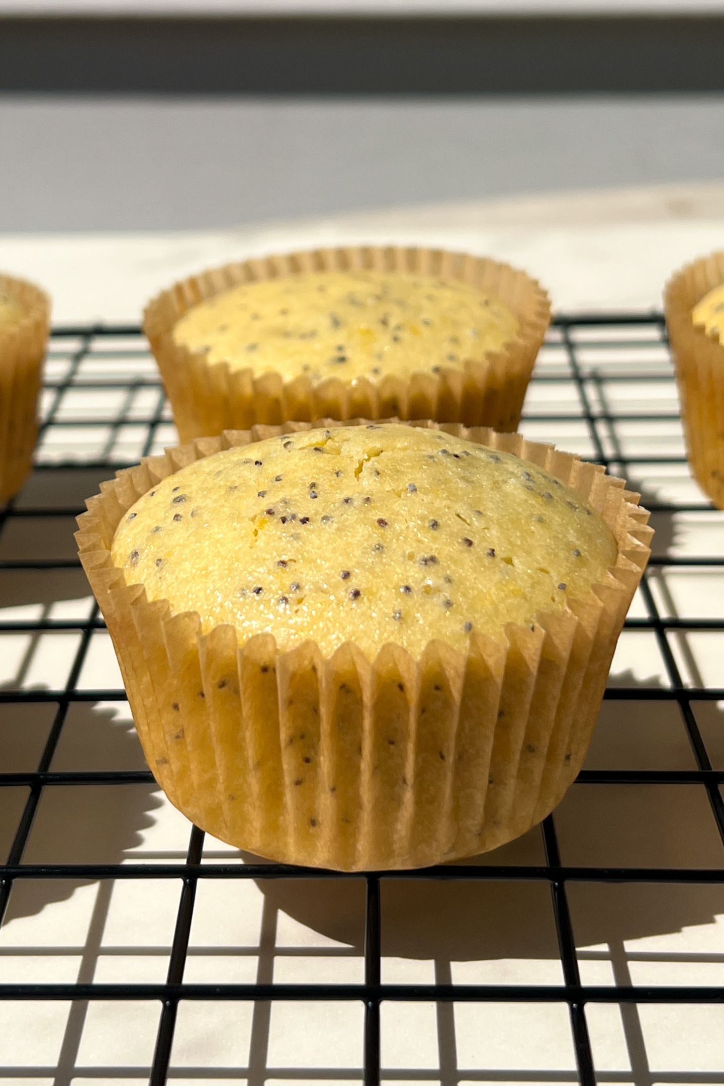 Baked cupcake on a cooling rack.
