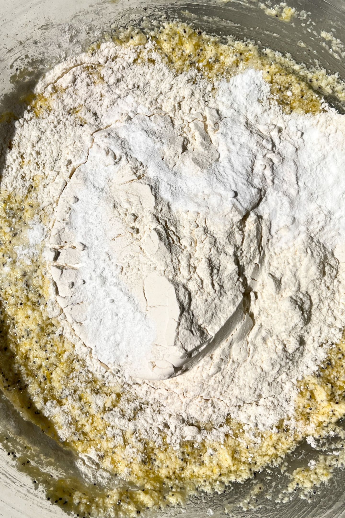 Dry ingredients added to the wet ingredients in a bowl.