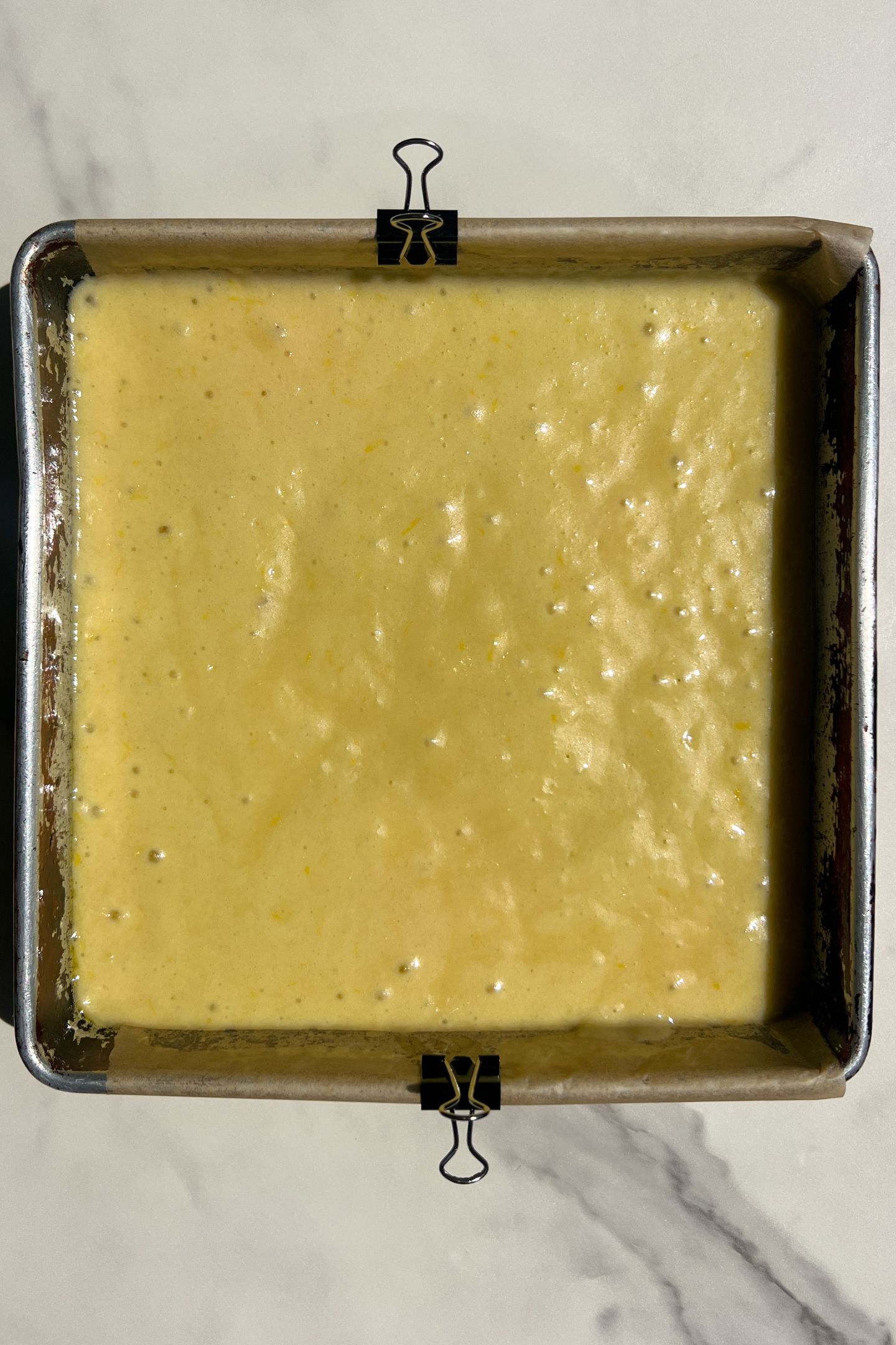 Cake batter in pan.