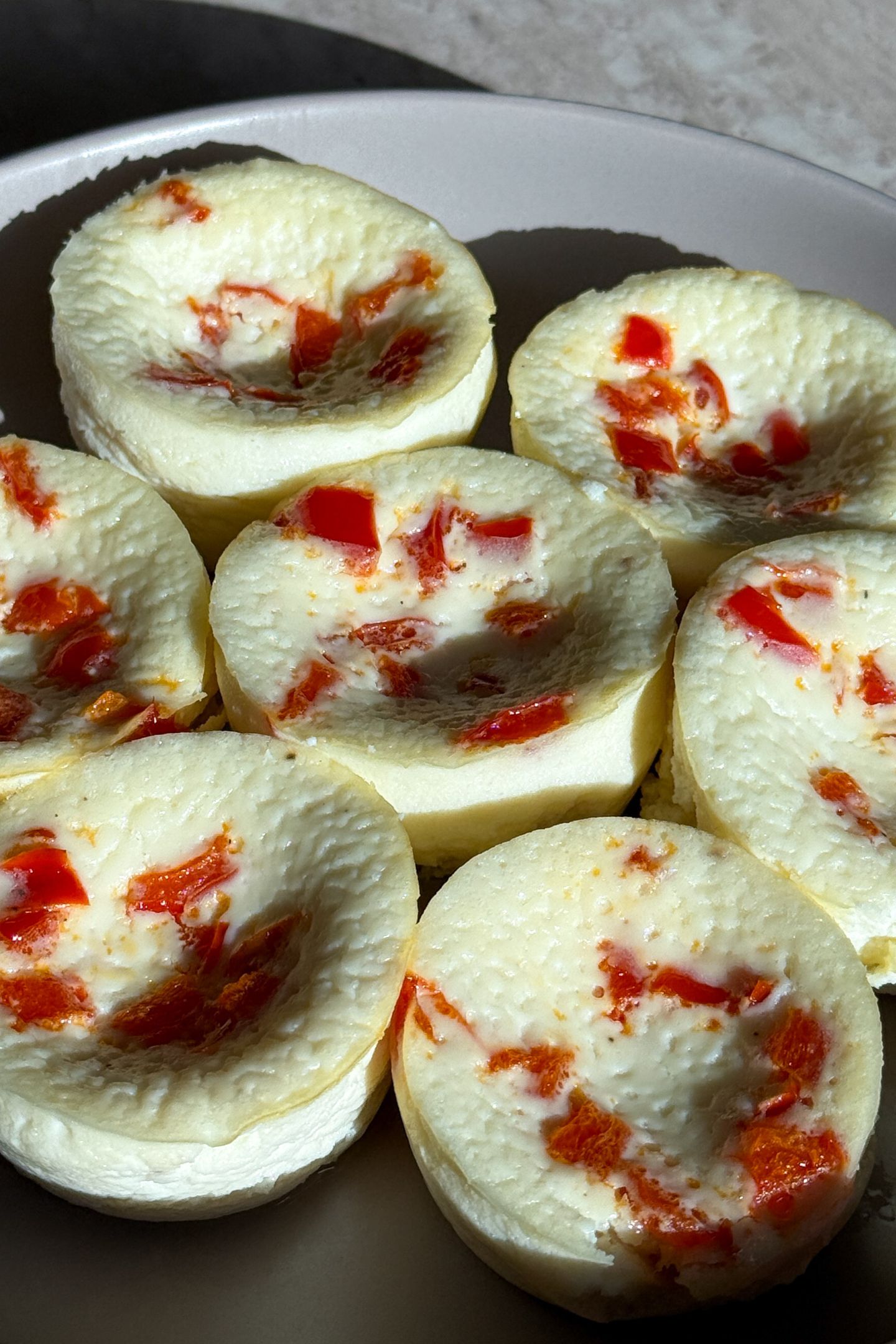 Side view of fluffy egg white bites made with ricotta cheese.
