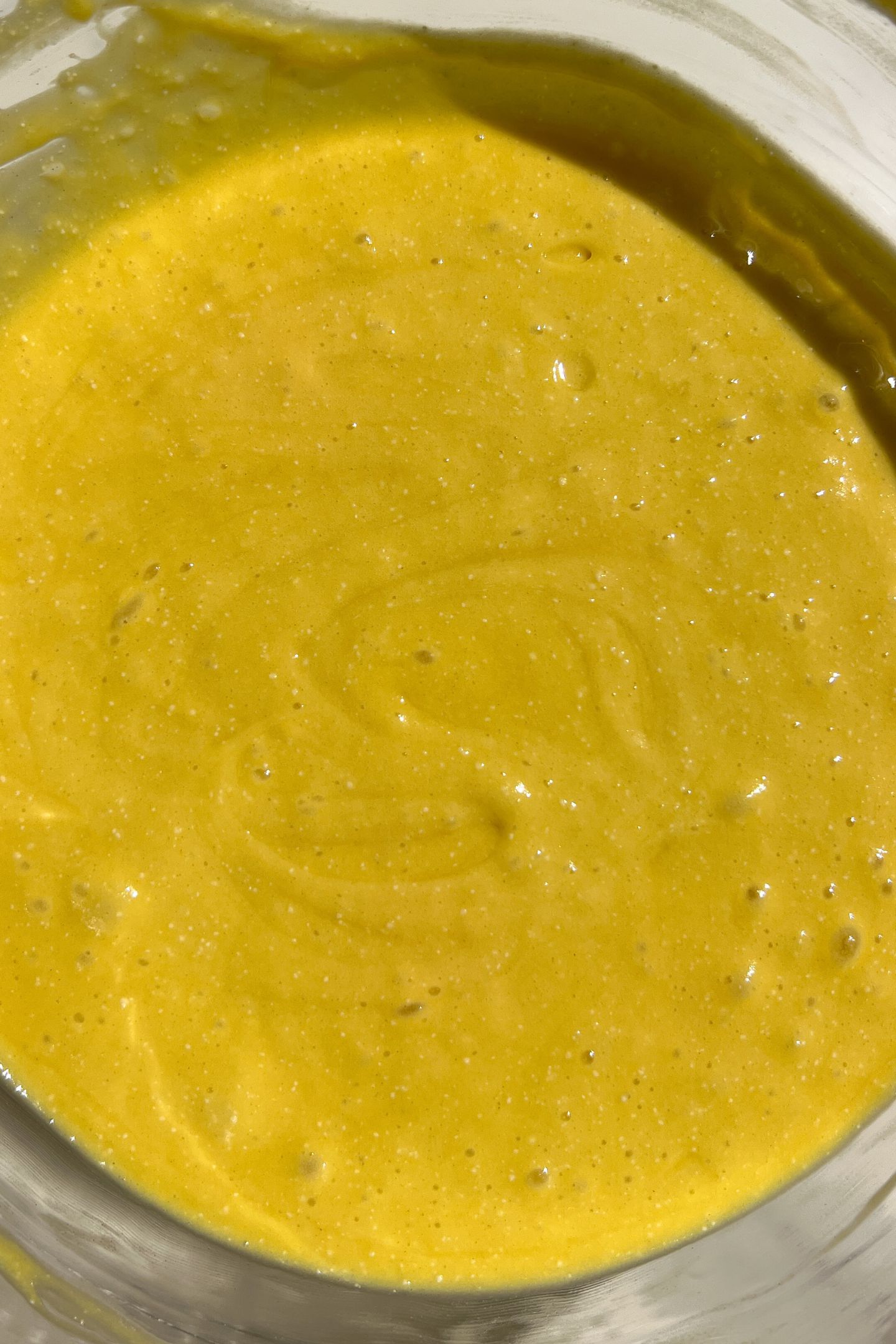 Making cake batter in a bowl.