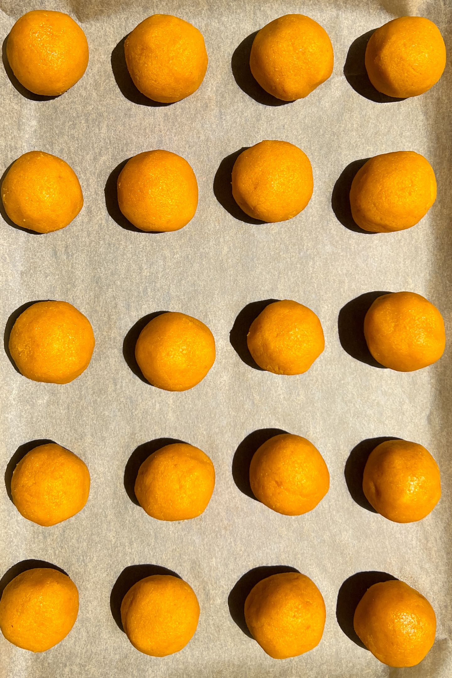 Cake pop balls on a tray.