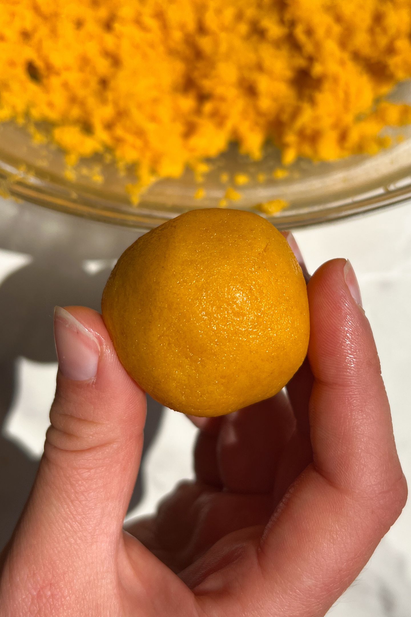 Holding a cake ball in my hand.