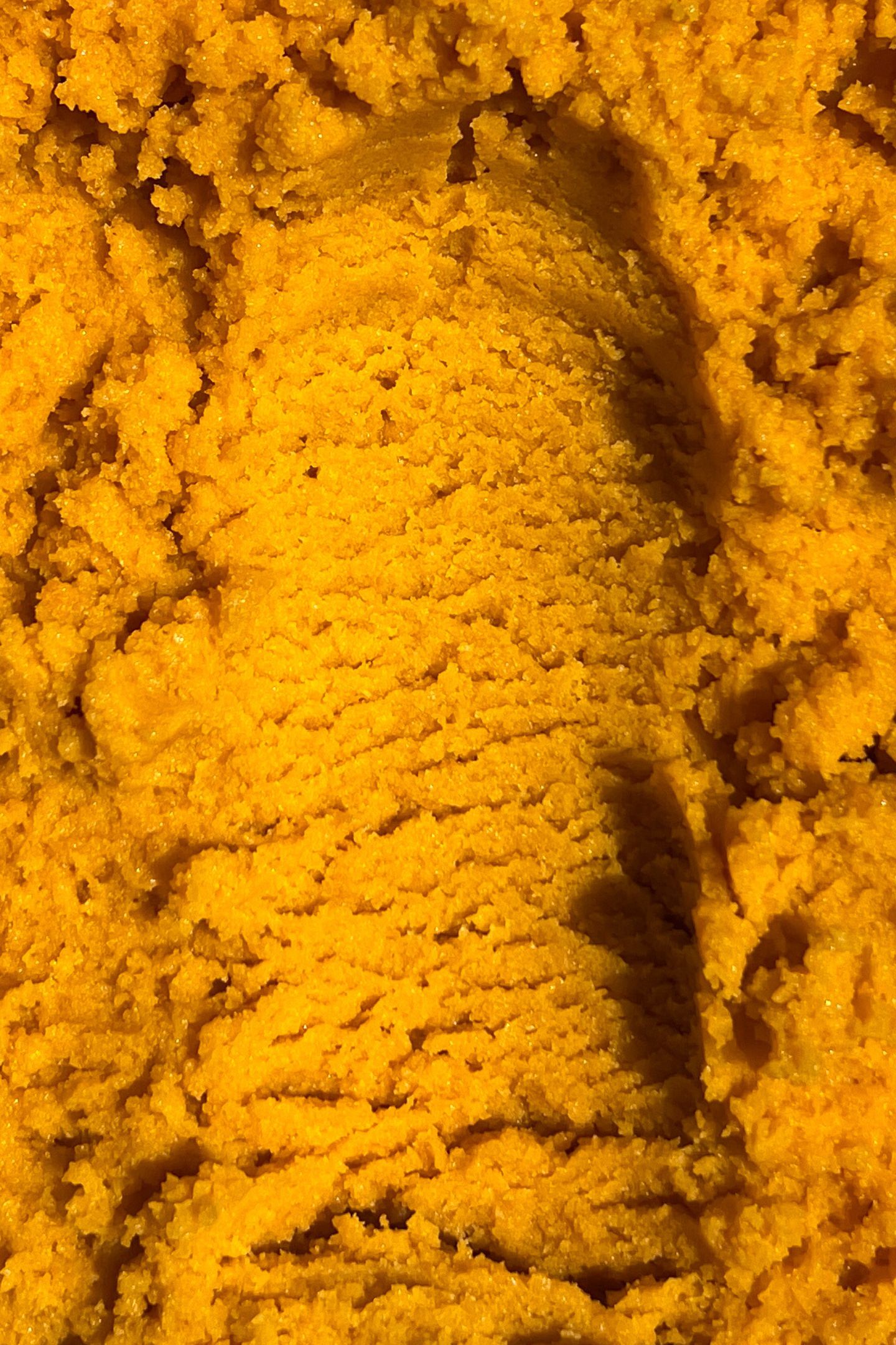 Scooped cake ball dough in a bowl.