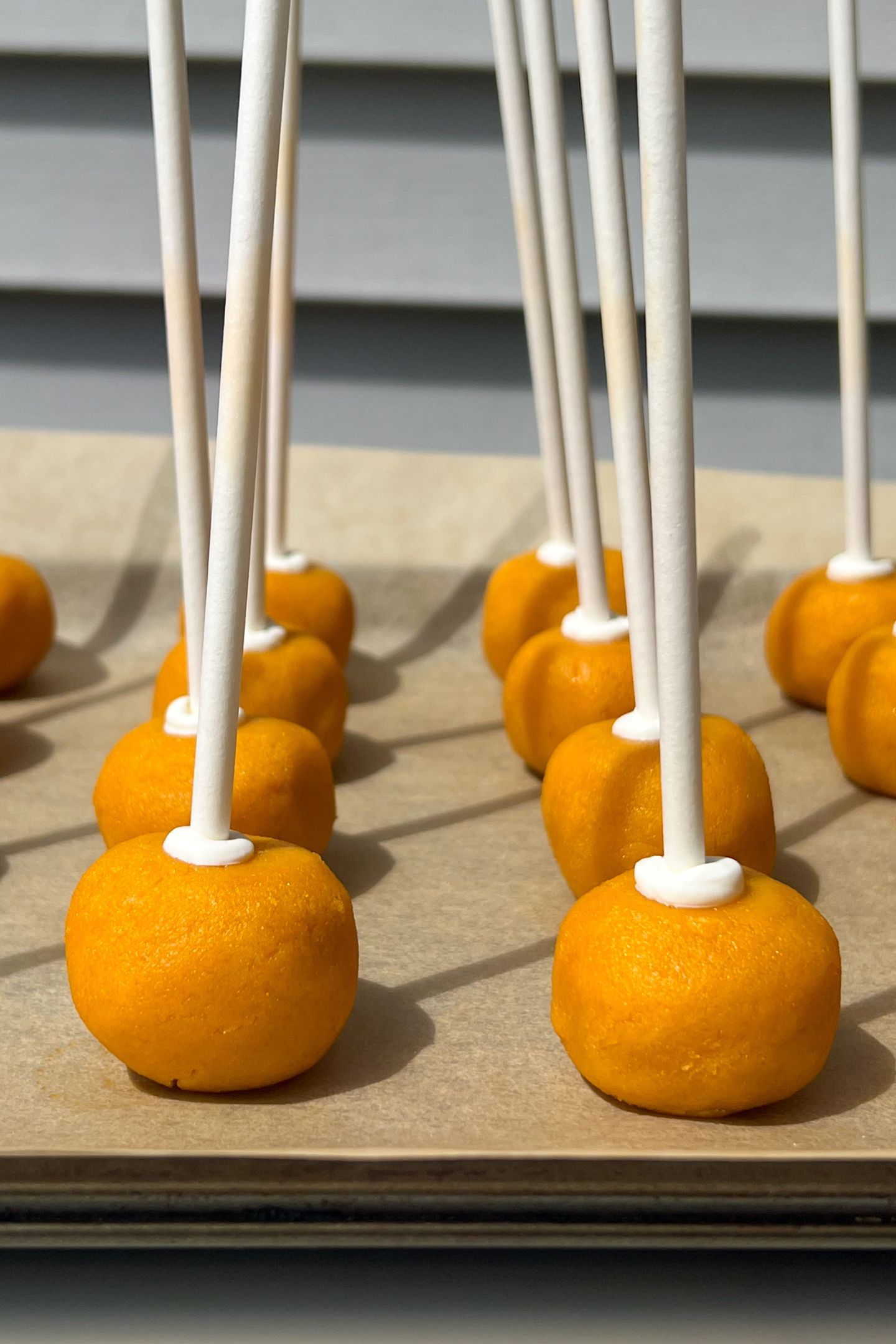 Cake pops on sticks.