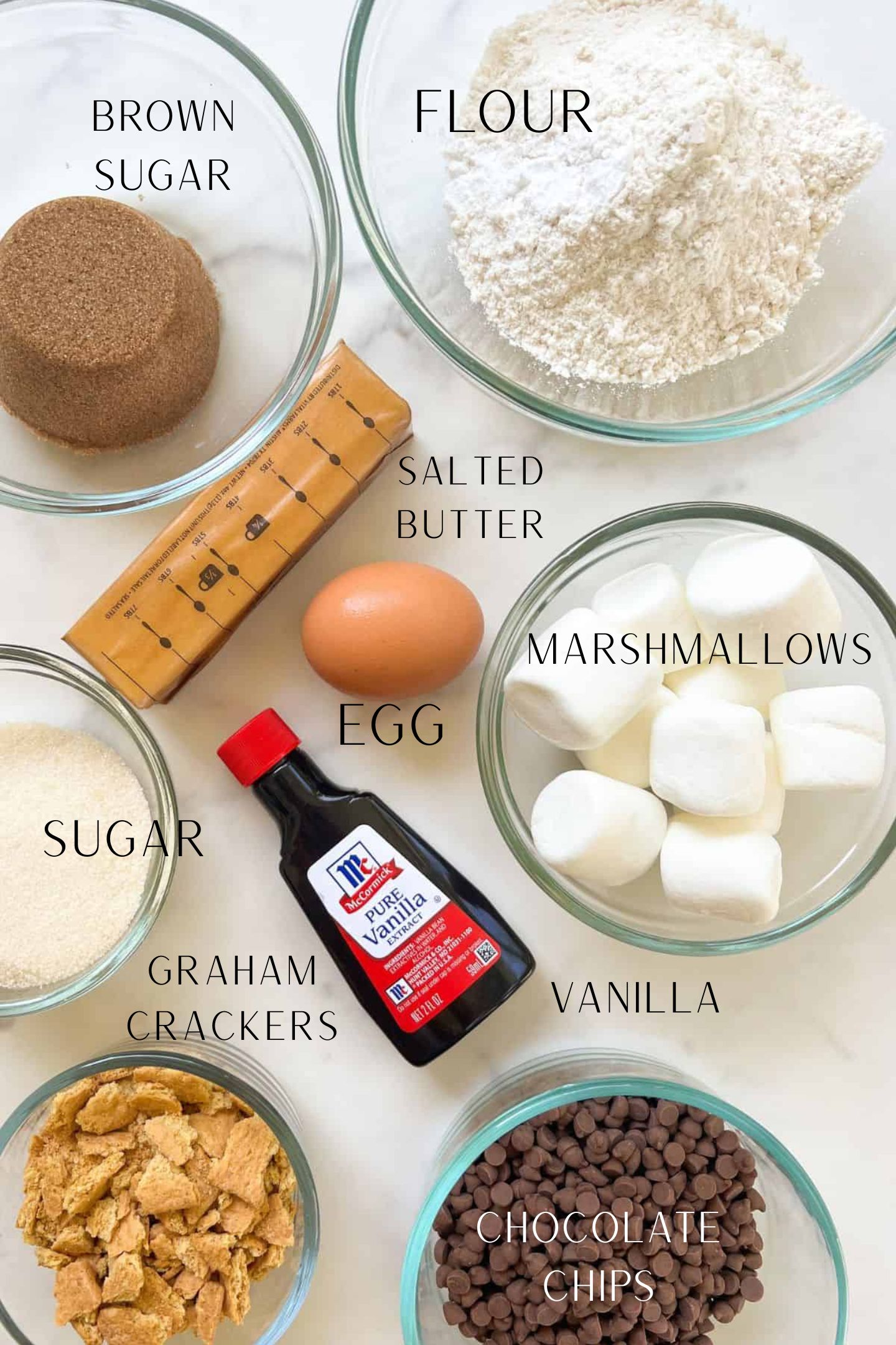 Ingredients measured out in bowls to make the chocolate chip and marshmallow cookies.