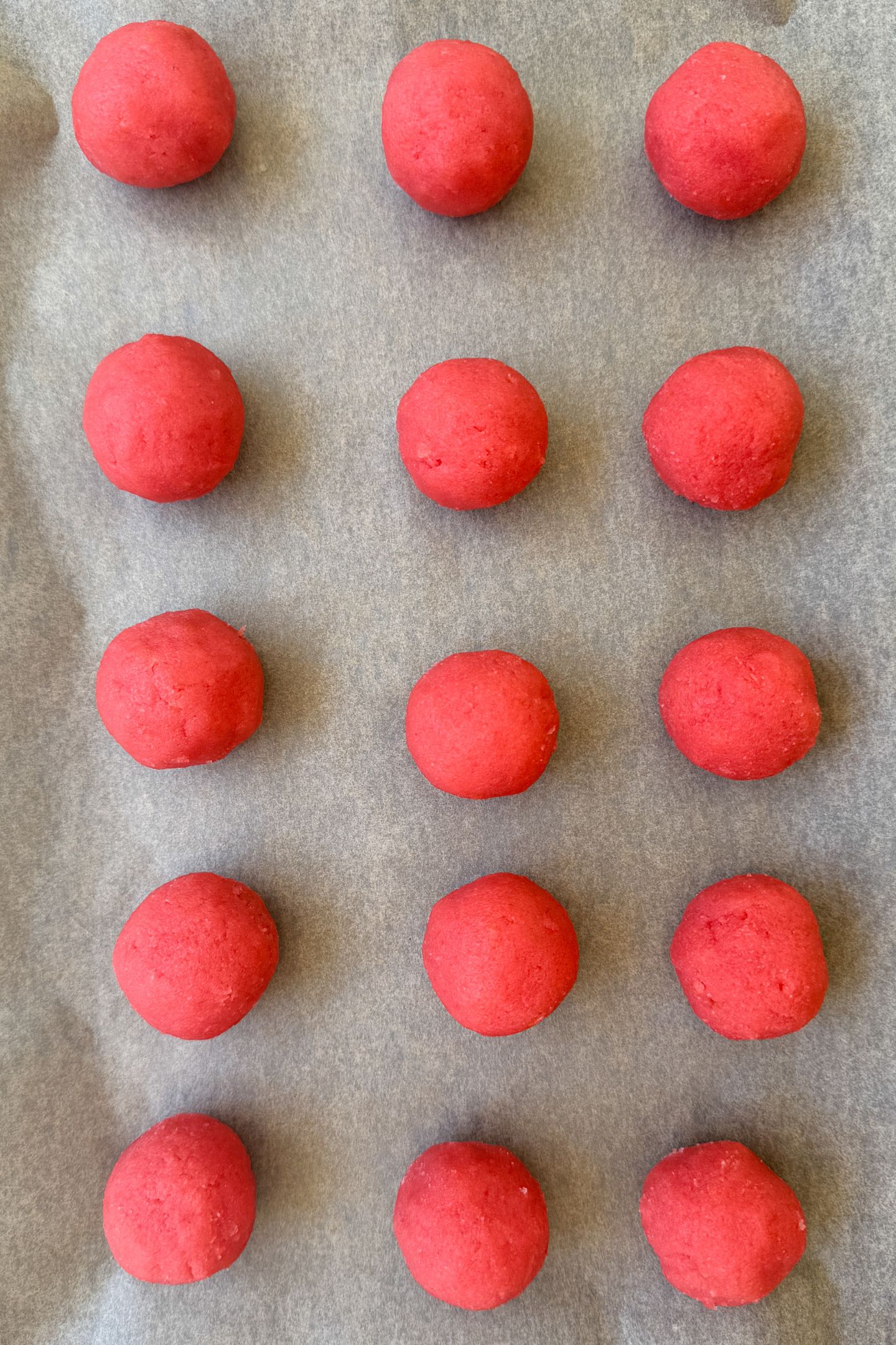 Cake pop balls on parchment paper.