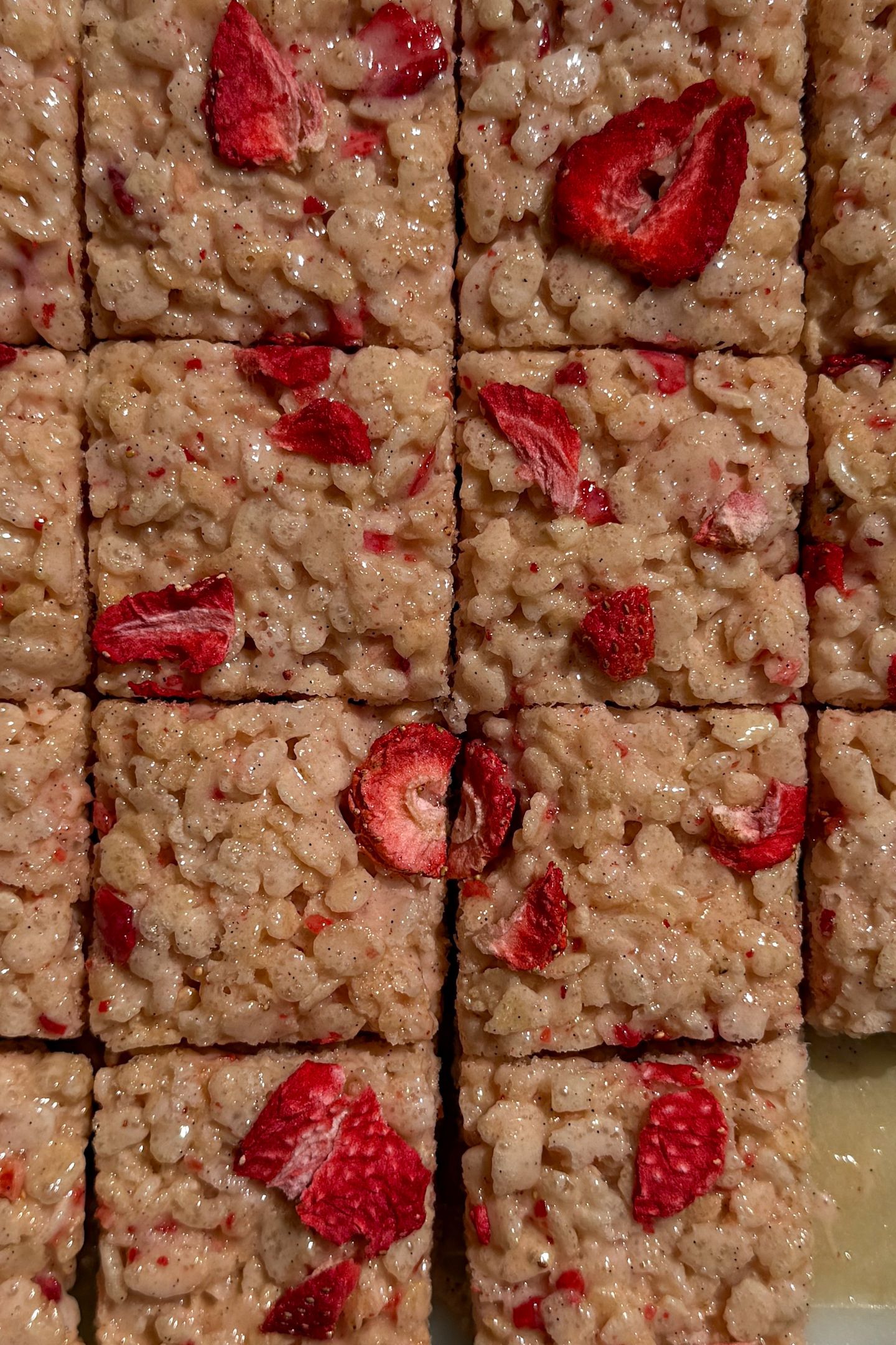 Sliced Rice Krispie Treats with freeze-dried strawberries throughout.