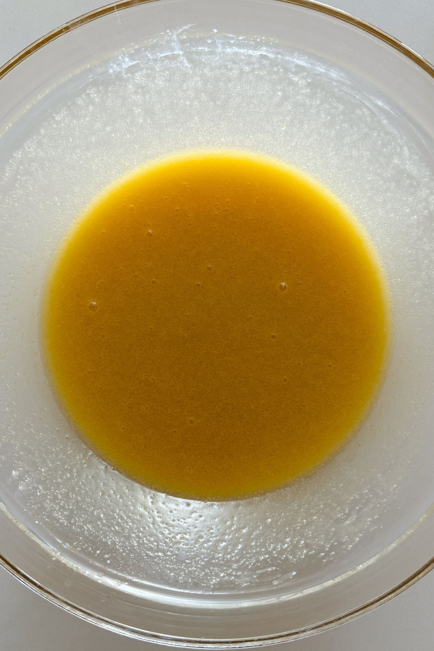 Mixed wet ingredients in a bowl.