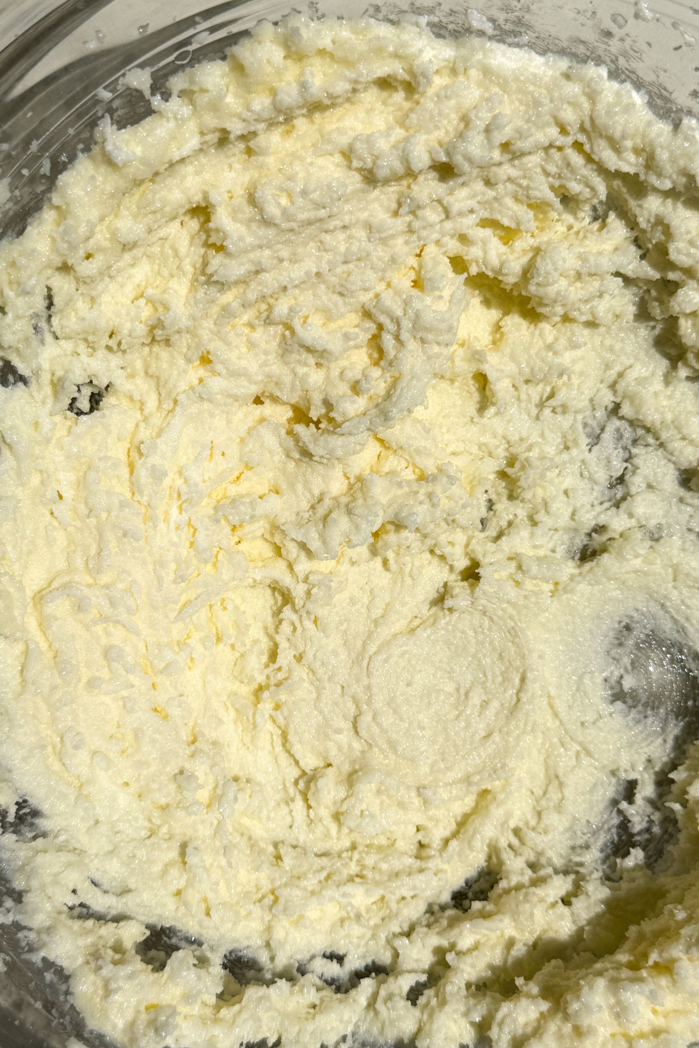 Butter and sugar creamed together in a bowl.