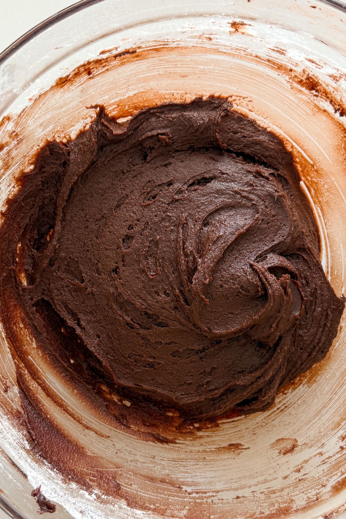 Chocolate cookie batter in a bowl.