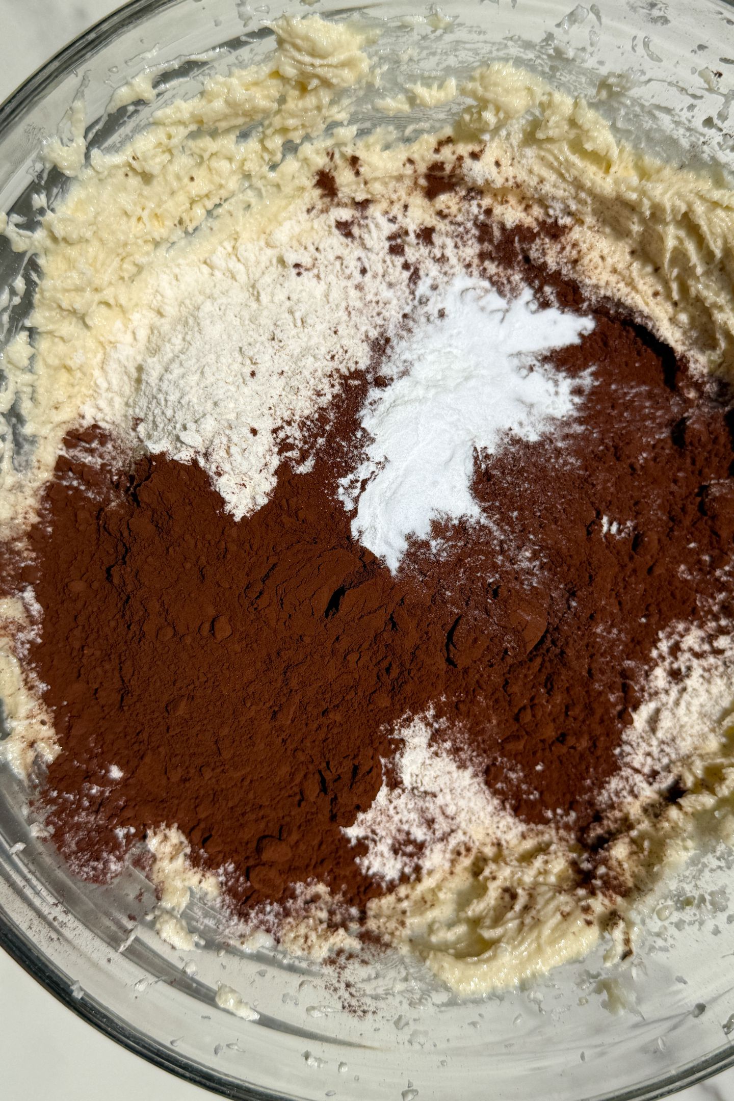 Making chocolate cookie dough in a bowl.