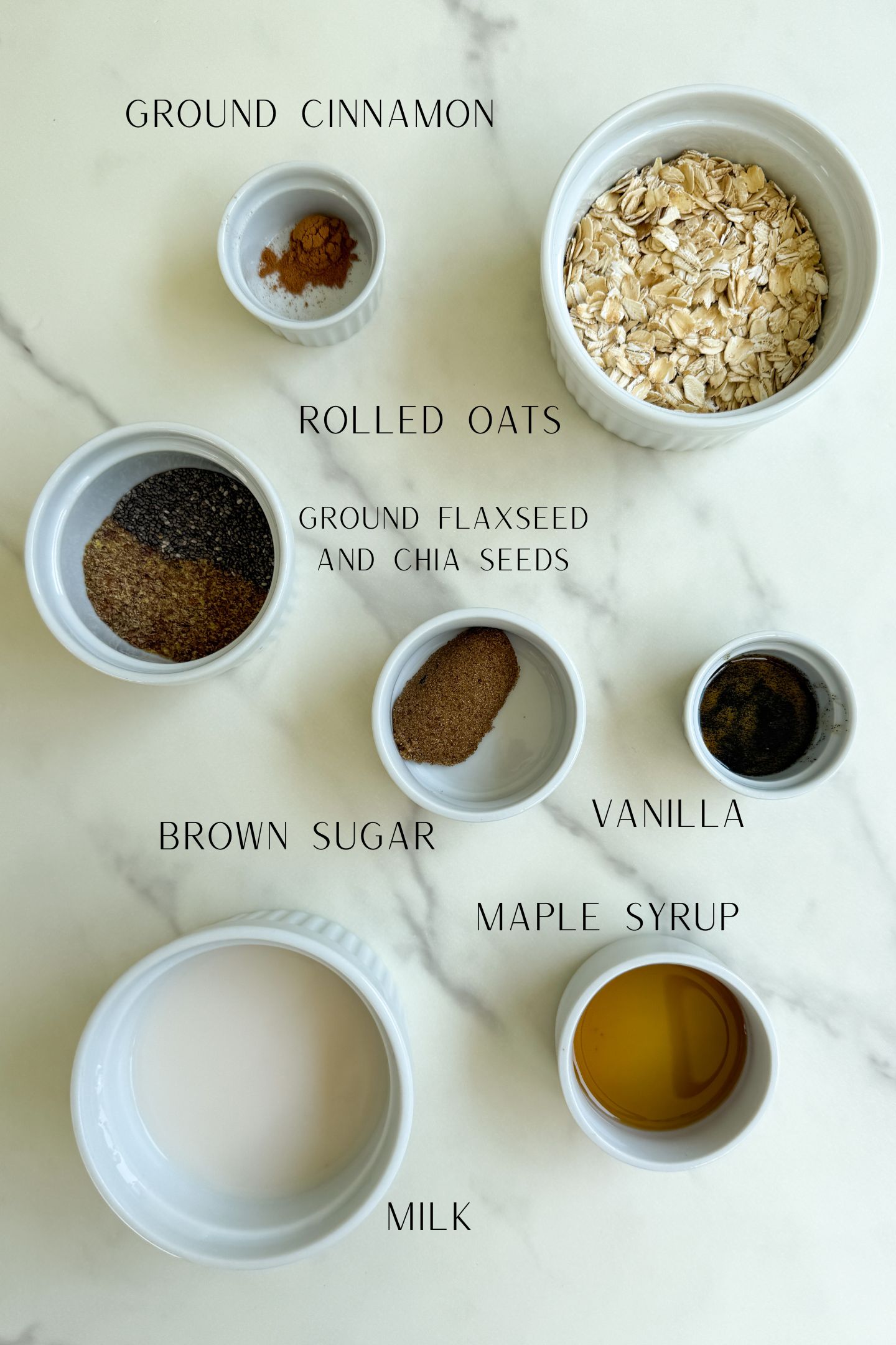 Oatmeal ingredients measured out in bowls to make the recipe.
