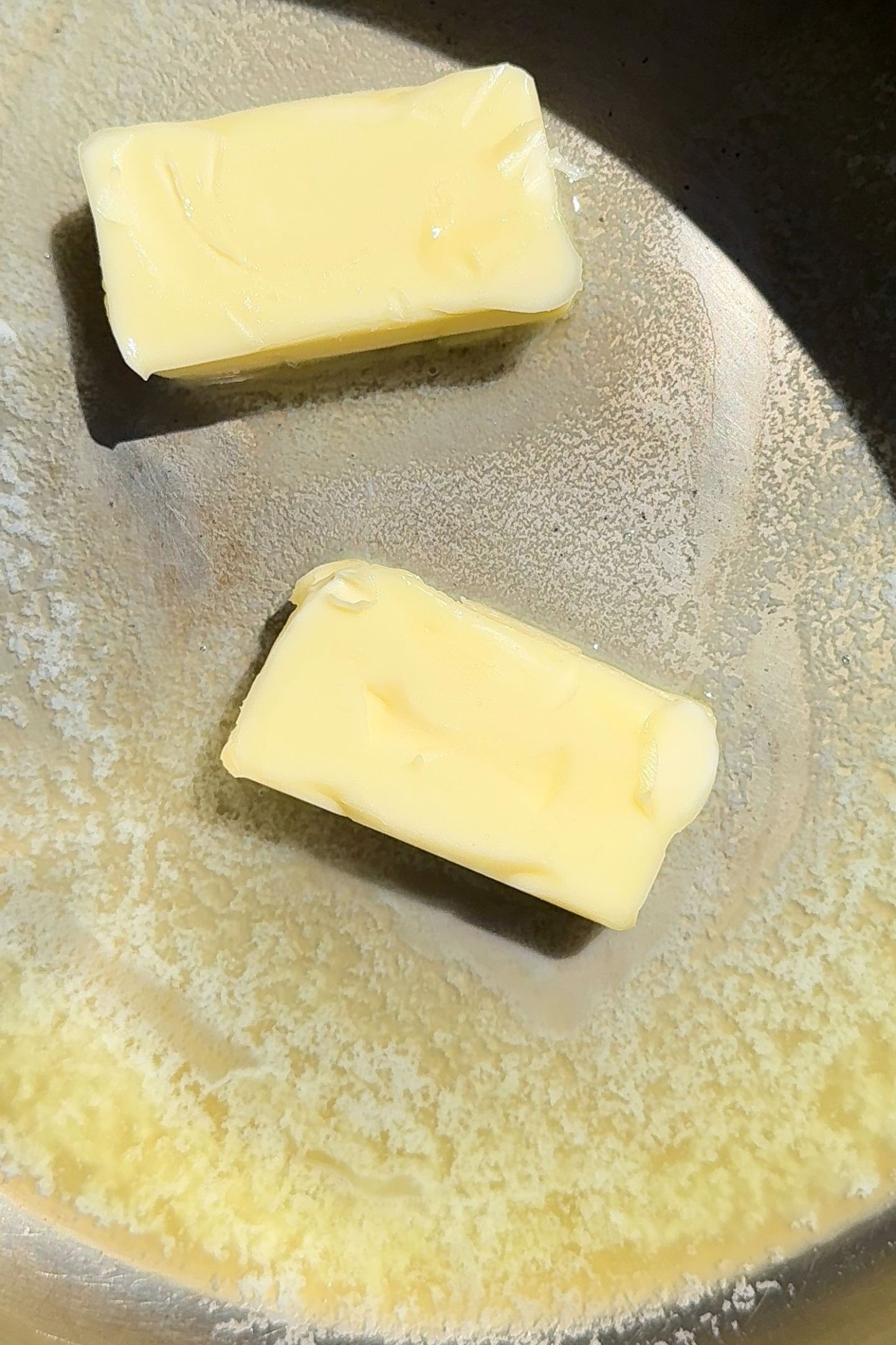 Butter in a pan.