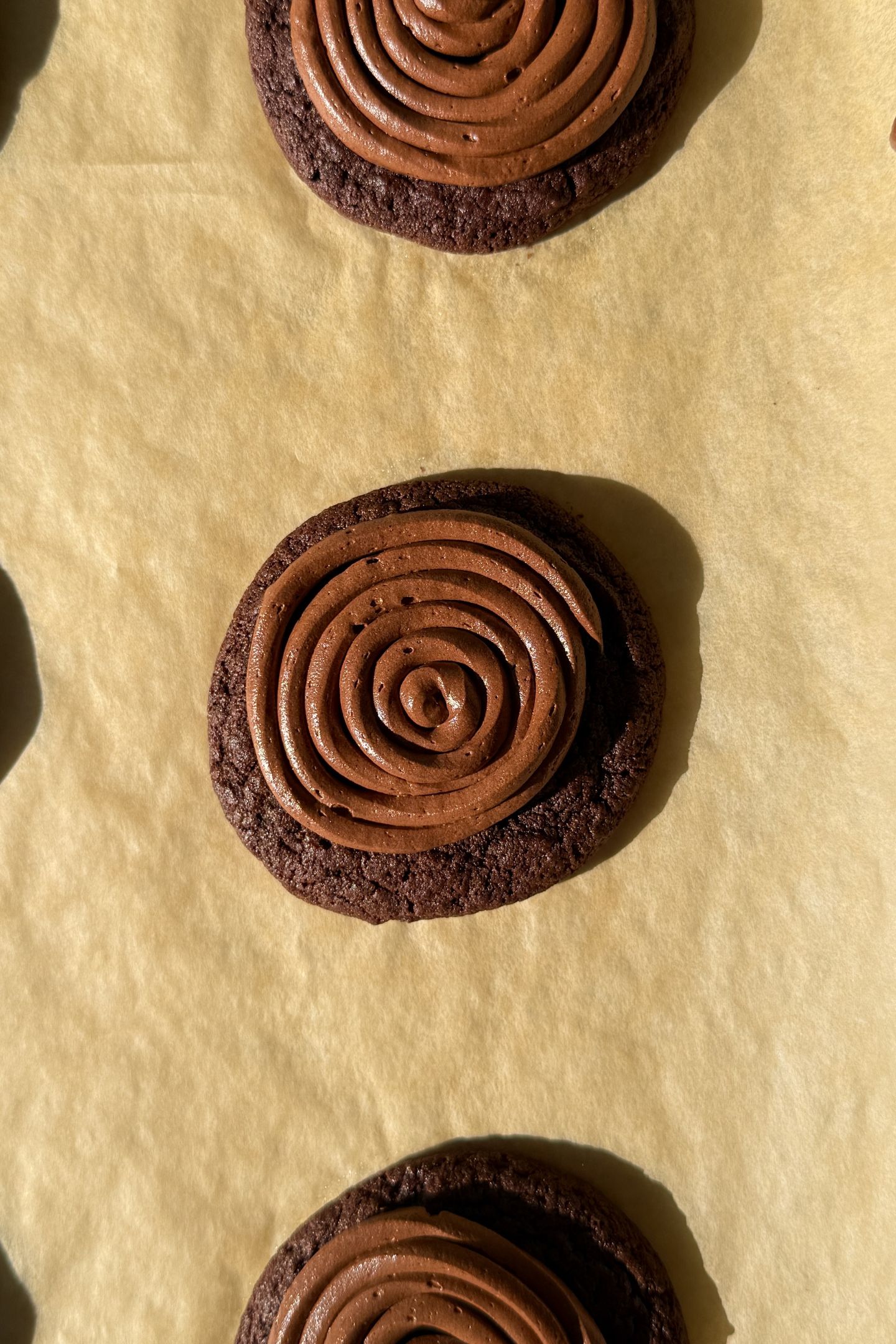 Frosting the cookies.