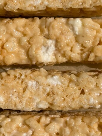 Sliced bars of Rice Krispie treats with mini marshmallows.