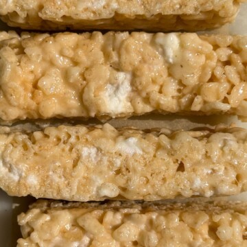 Sliced bars of Rice Krispie treats with mini marshmallows.