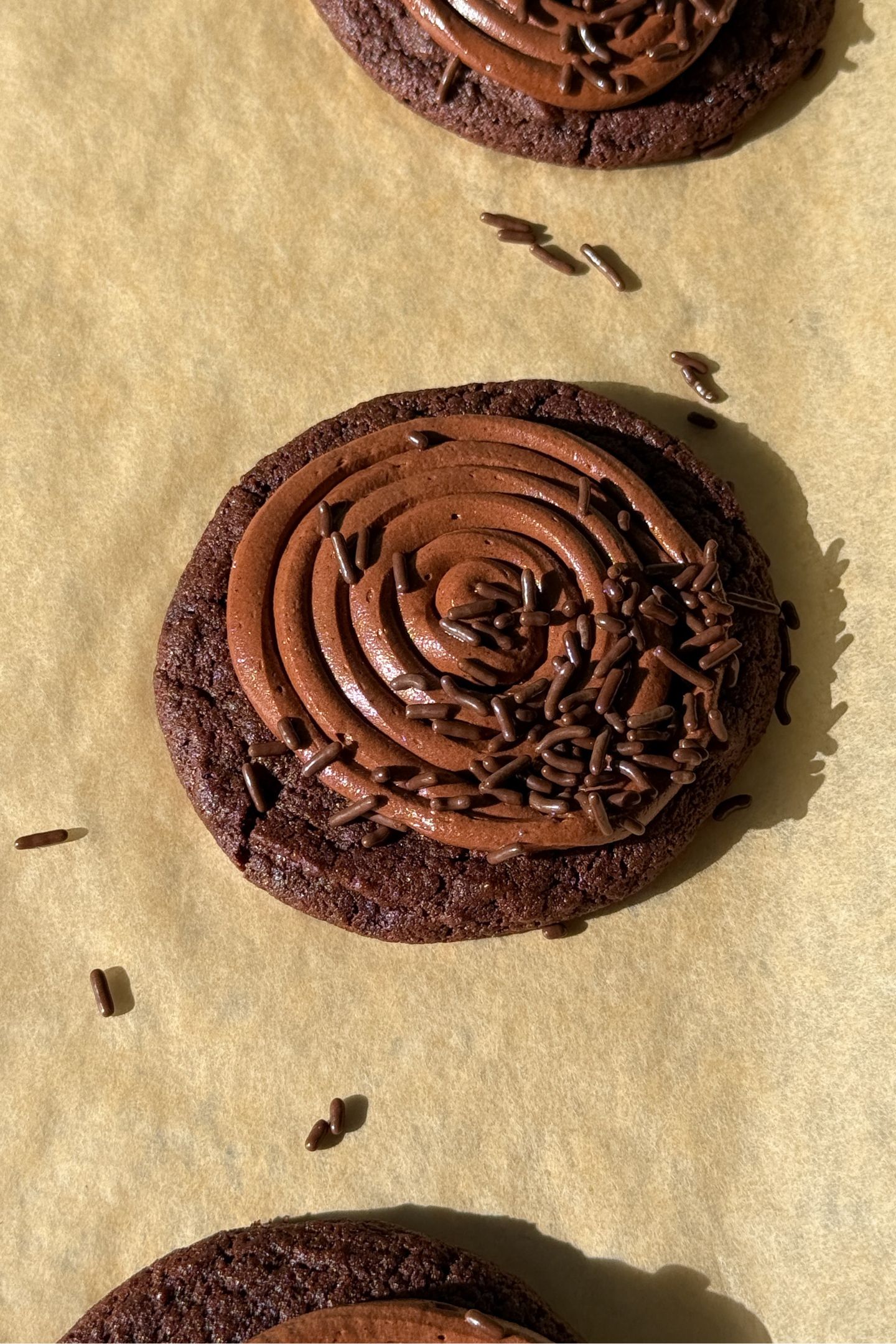Sprinkles added on top of the chocolate cookie.