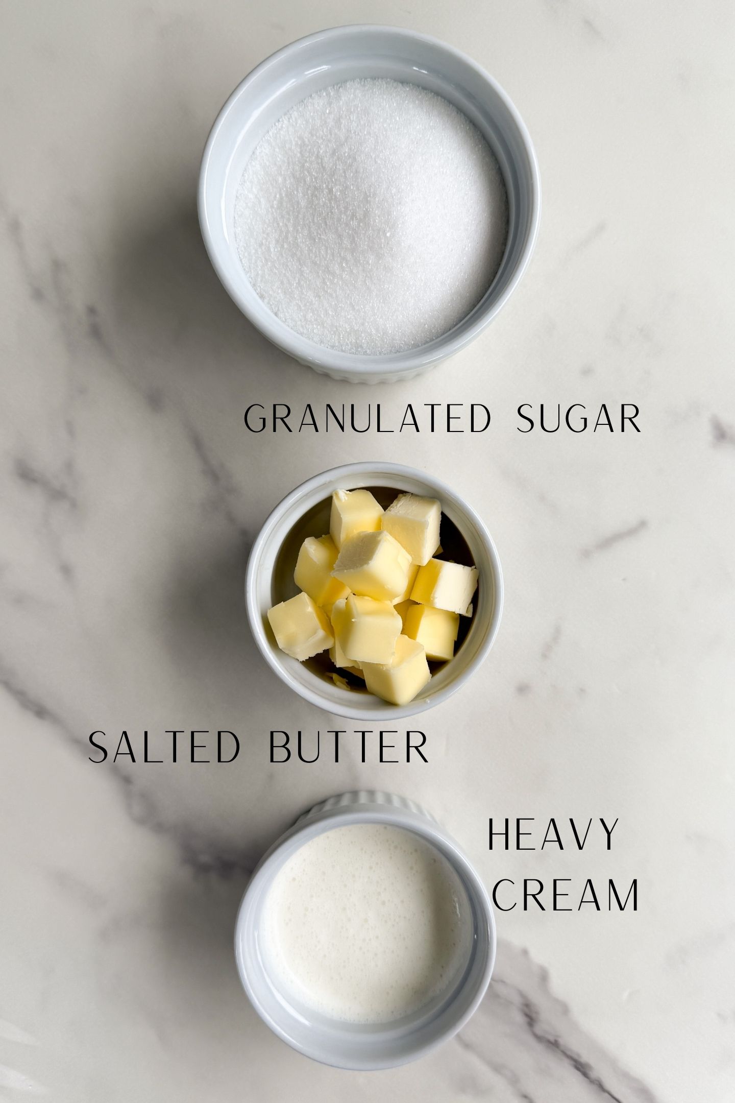Caramel ingredients measured out in bowls.