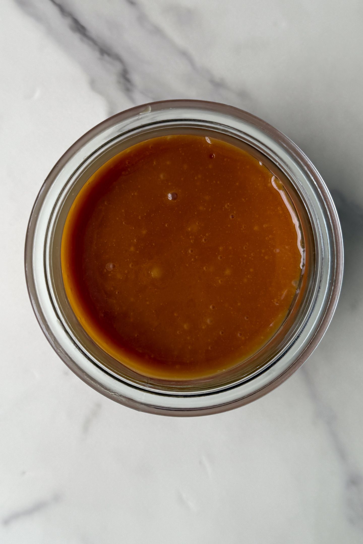 Caramel in a glass jar from a Birds Eye view.