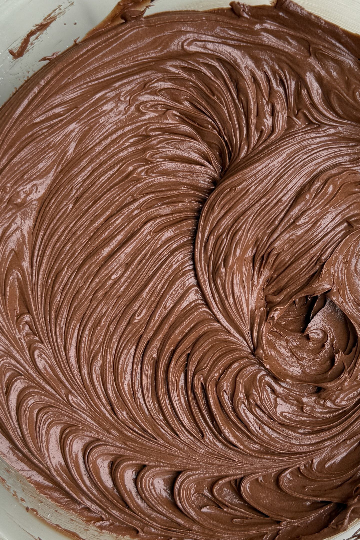 Making the chocolate buttercream in the bowl.