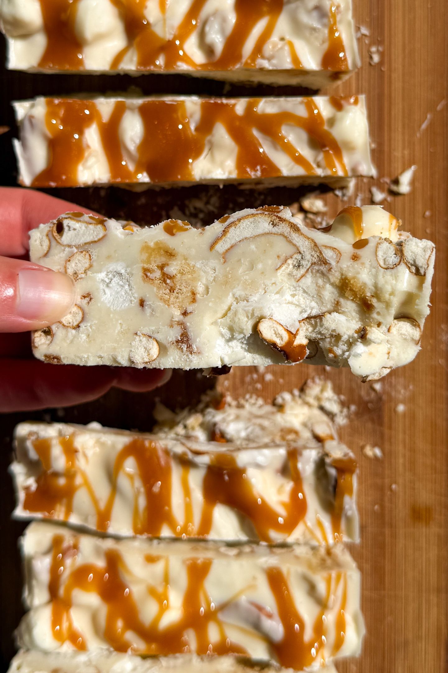 Holding a piece of rocky road in my hand.