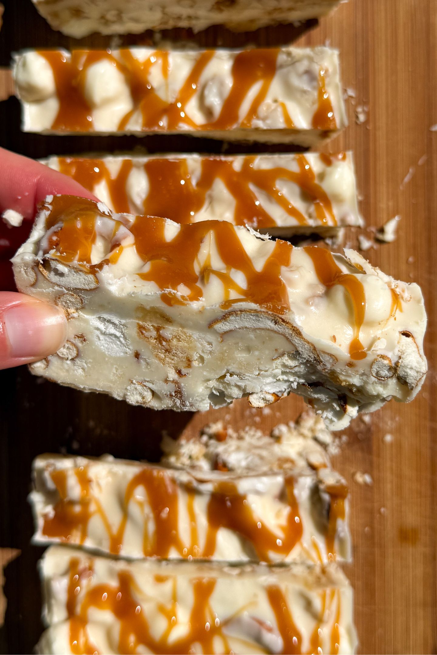 Holding a piece of rocky road in my hand.