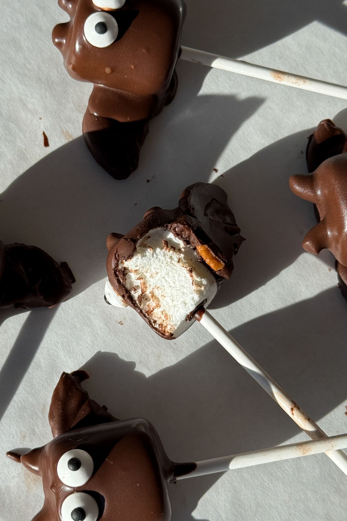 Marshmallow pops that look like a bat with a bite taken out of one.