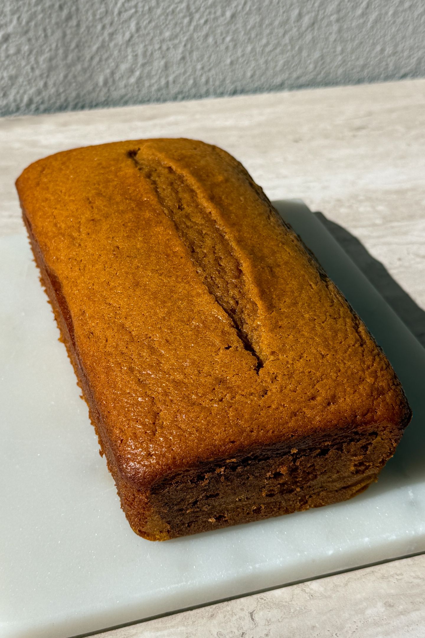 Baked pumpkin bread cooled and on a platter.