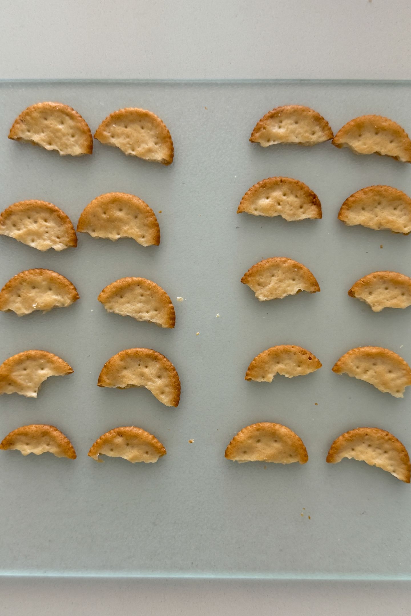 Cracker halves on a cutting board to make the wings.