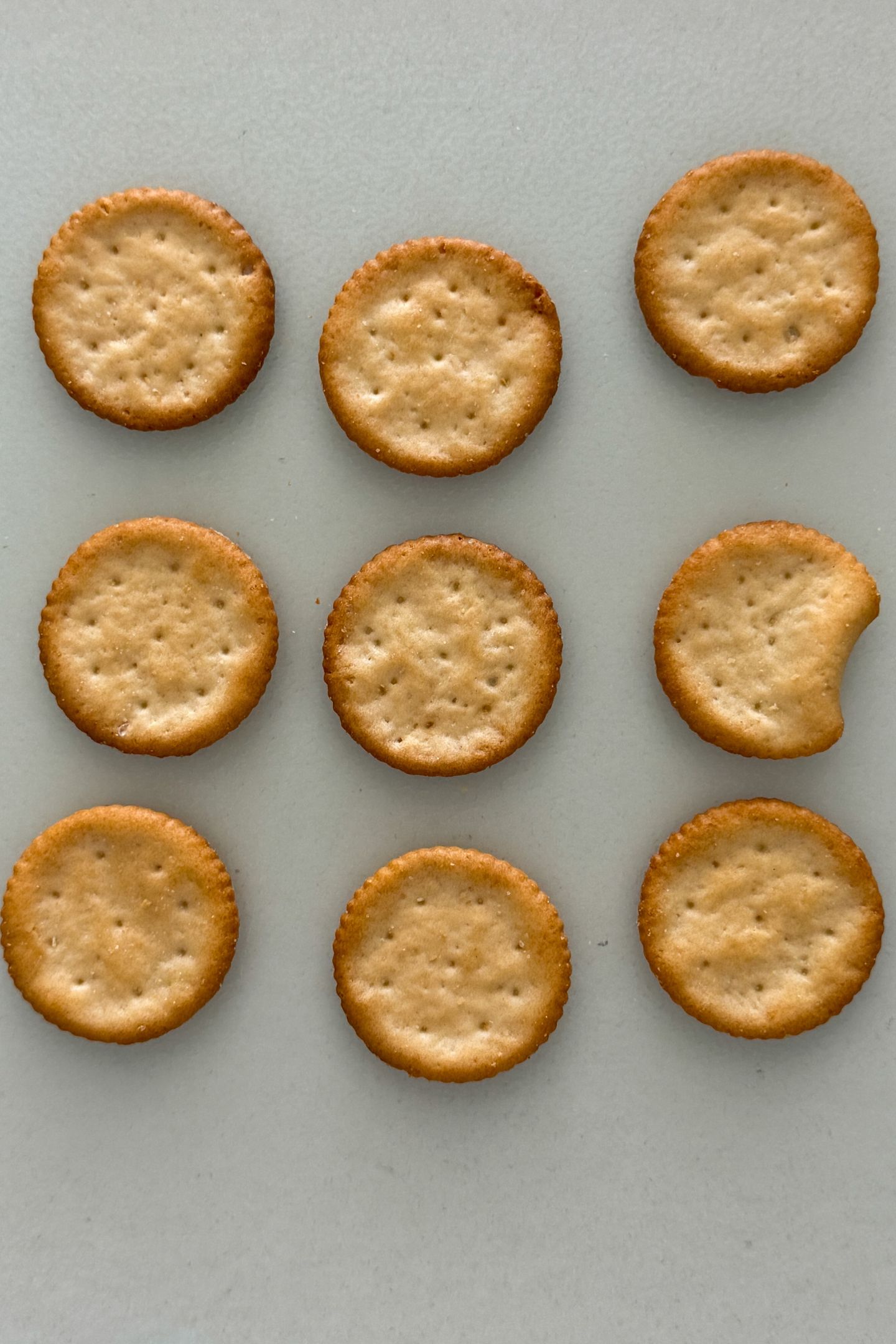 Crackers on a cutting board.