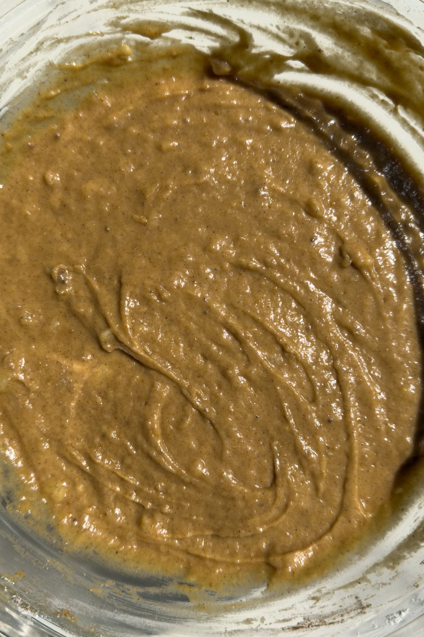 Pumpkin banana bread muffin batter in a bowl.