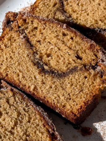 Slice of apple cider donut bread showing the layers.