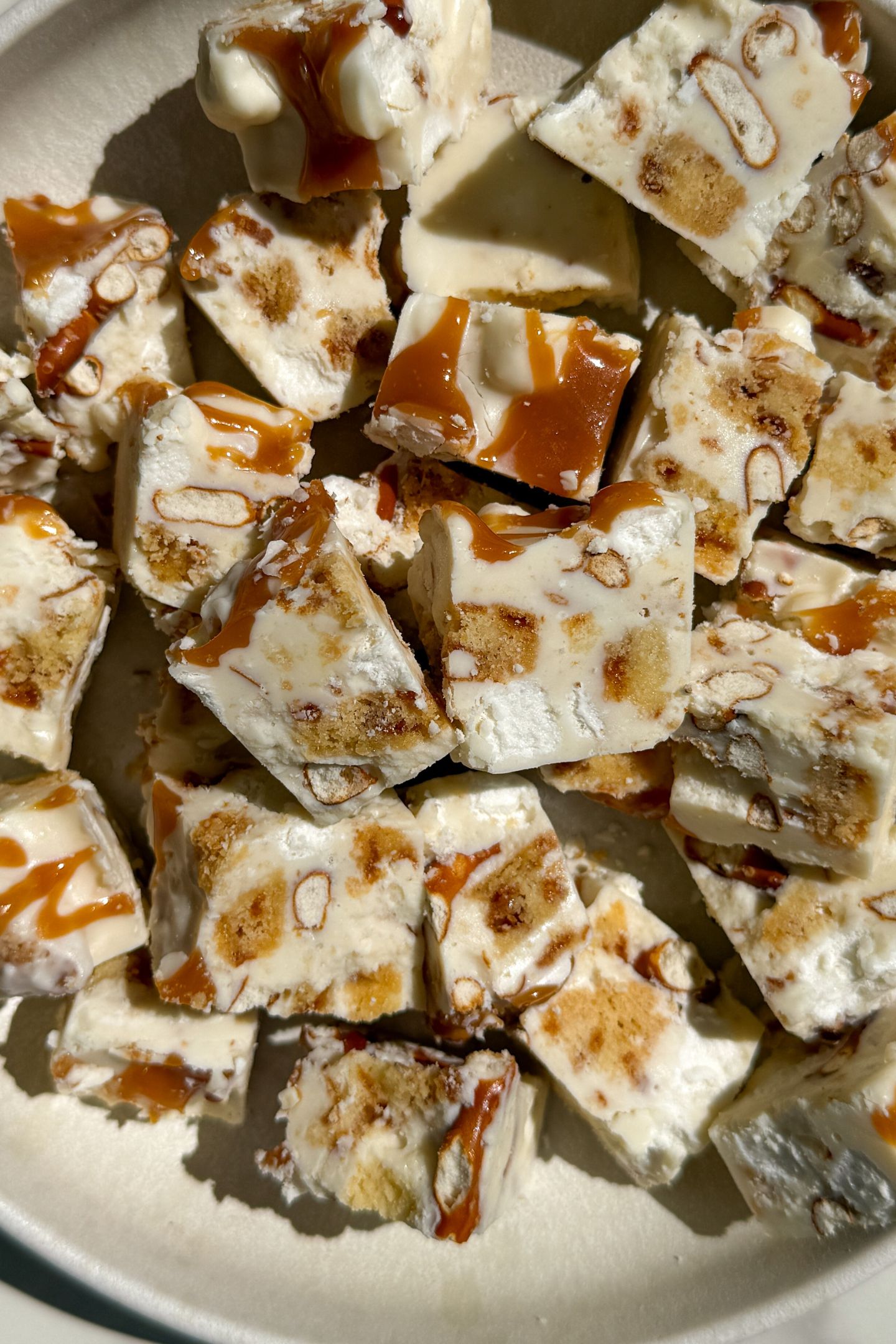 Pieces of white chocolate rocky road in a bowl.