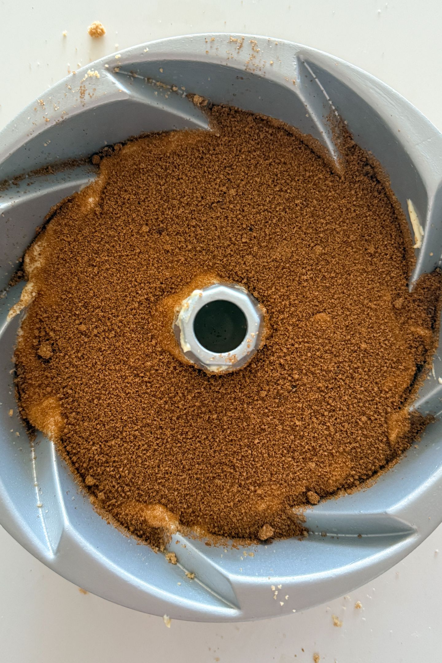 Adding cinnamon swirl mixture on top of the batter.