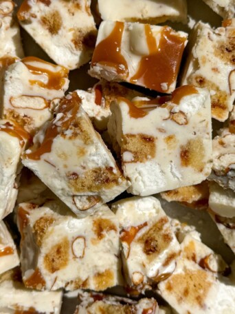 Chunks of white chocolate rocky road with swirls of caramel, pretzels, marshmallows and shortbread.