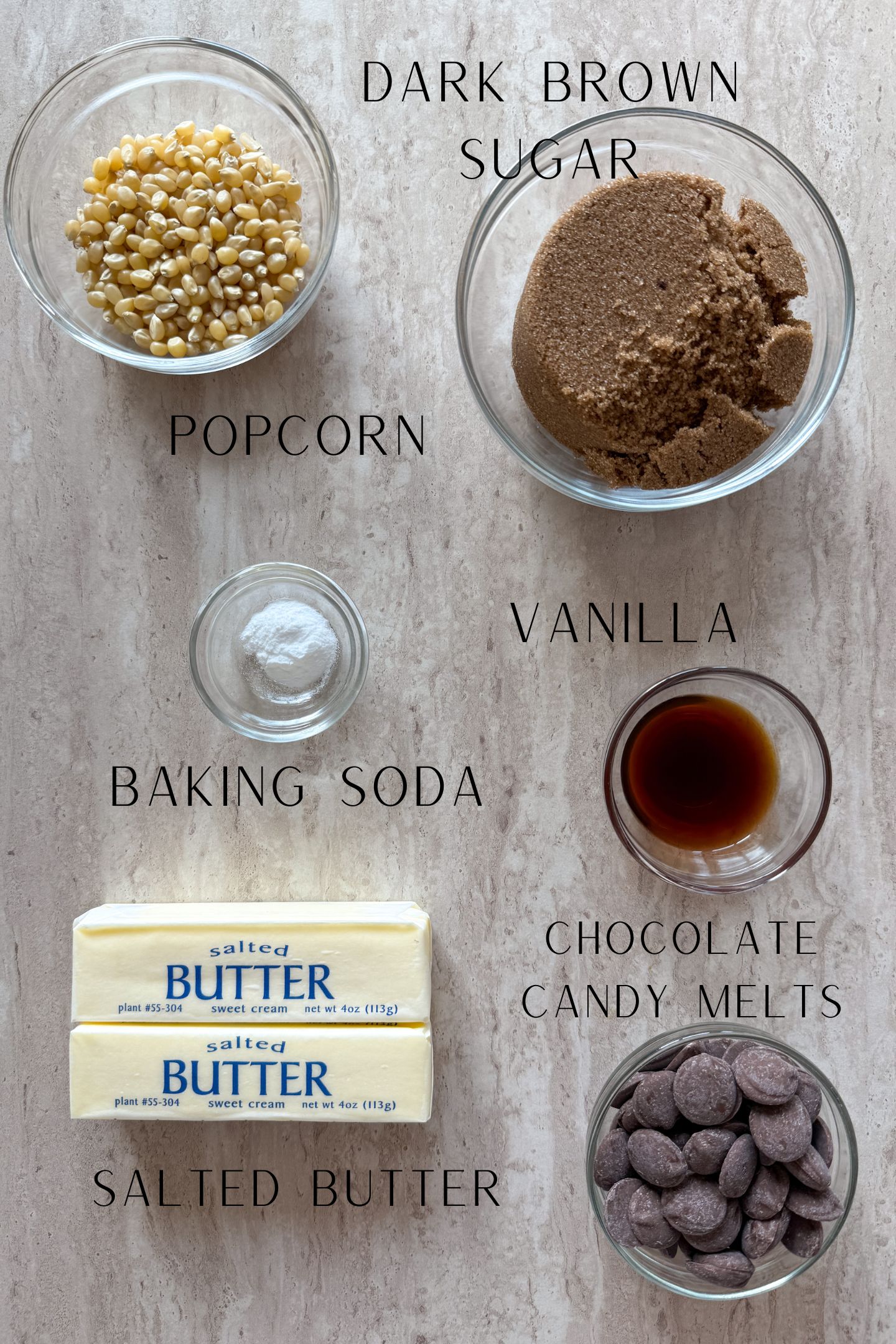 Ingredients measured out in bowls to make the homemade chocolate caramel popcorn.