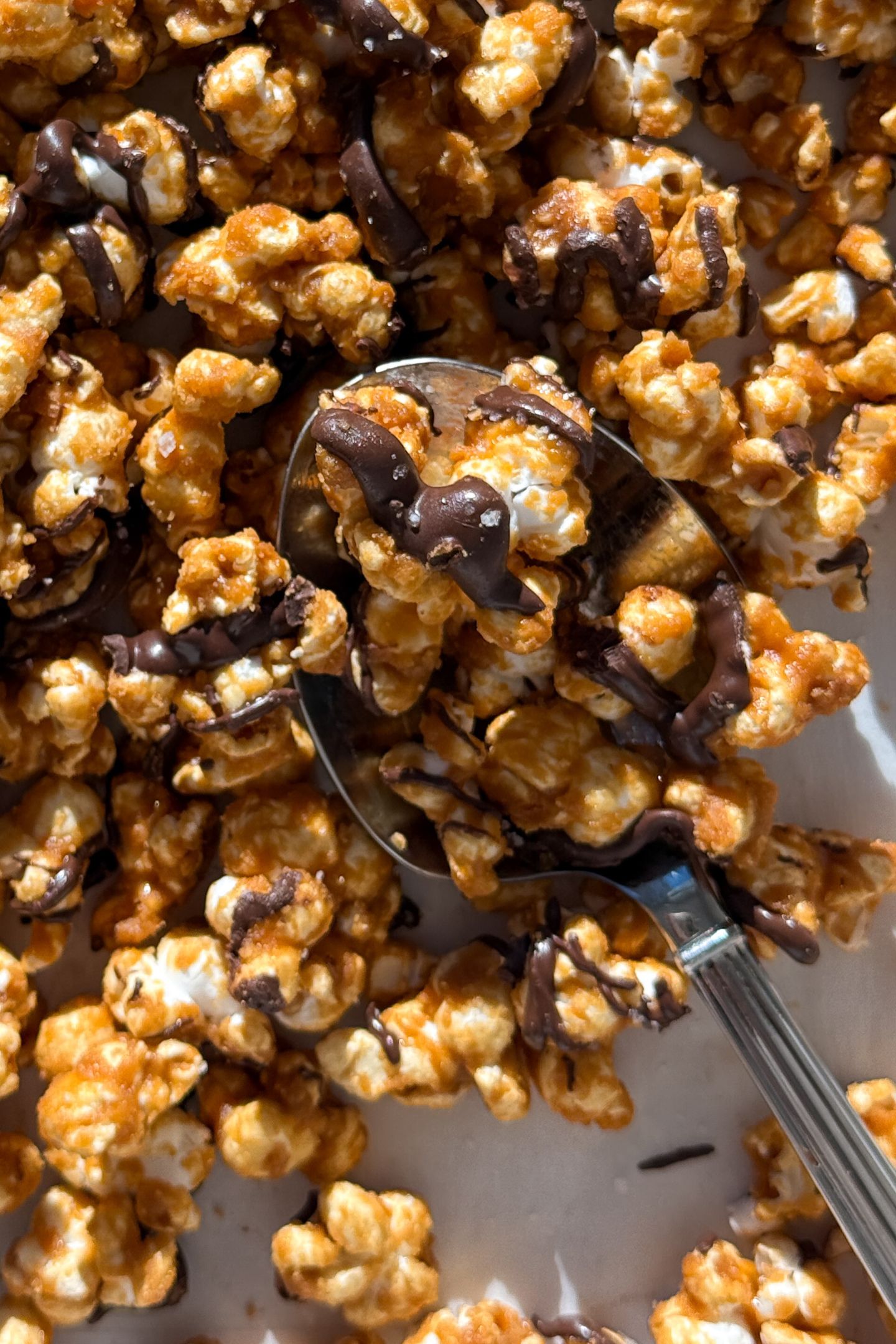 Chocolate caramel popcorn topped with sea salt flakes.