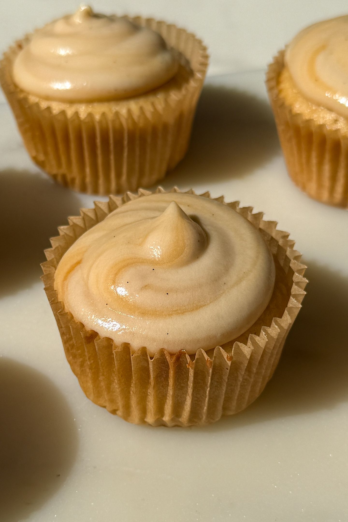 Salted caramel frosting on top of a cupcake.