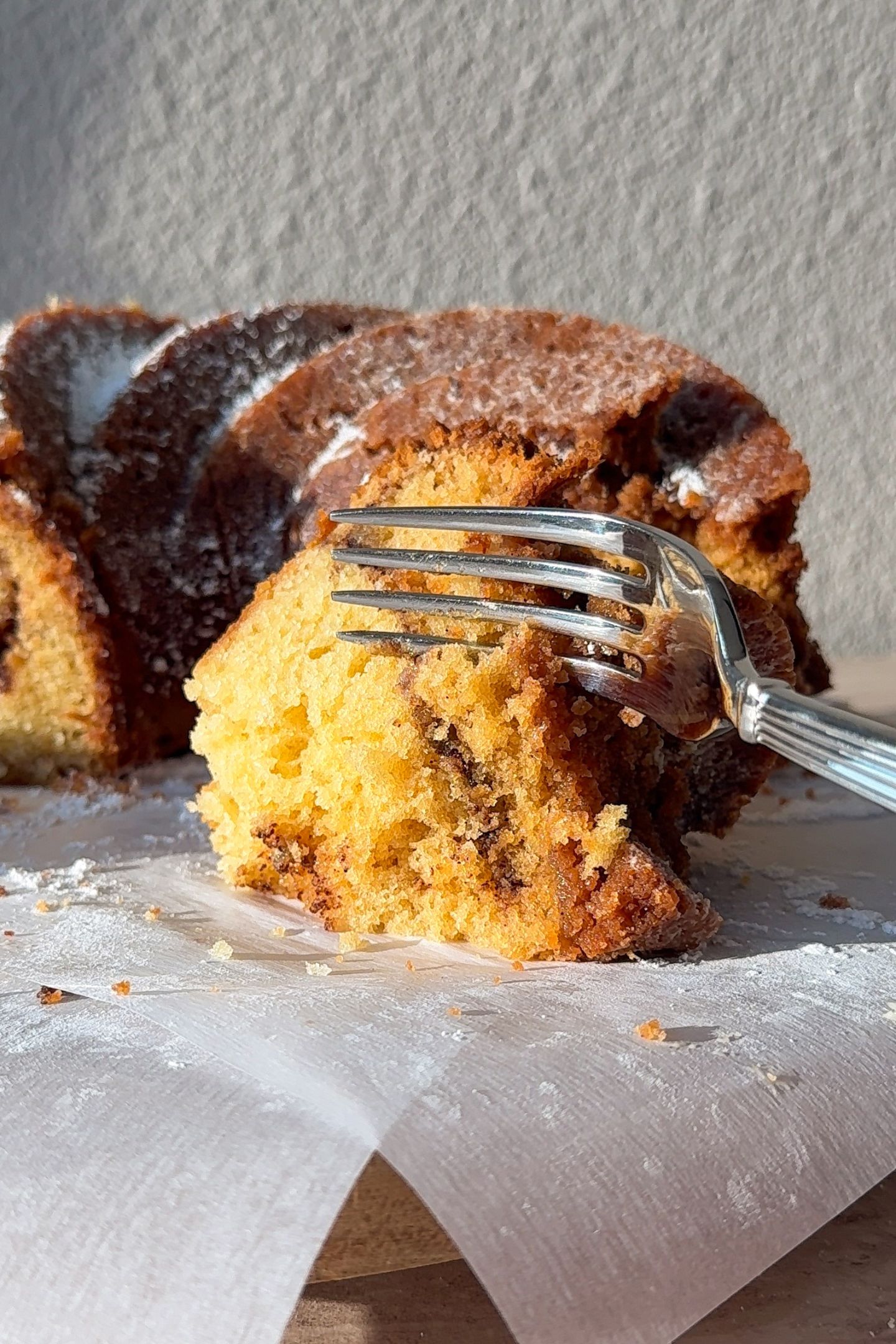 Eating a slice the bundt cake with a fork.