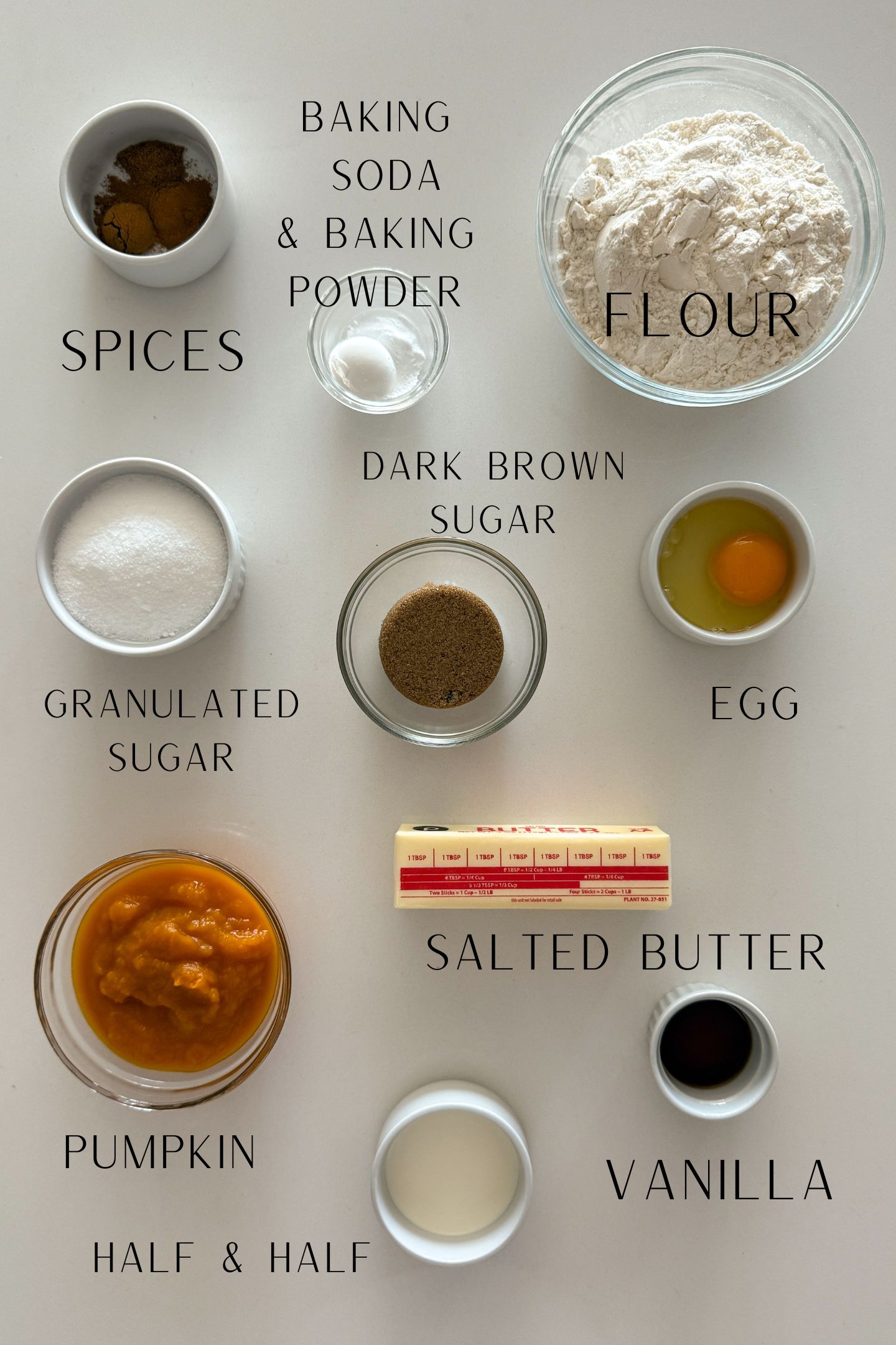 Ingredients measured out in bowls to make the soft pumpkin cookies.