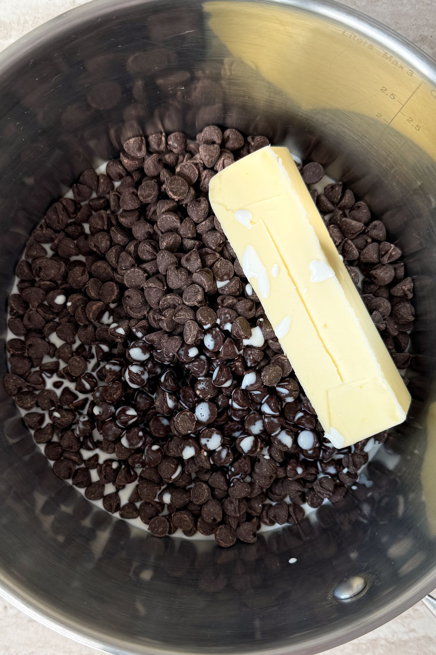 Chocolate, butter, vanilla and milk in a saucepan.